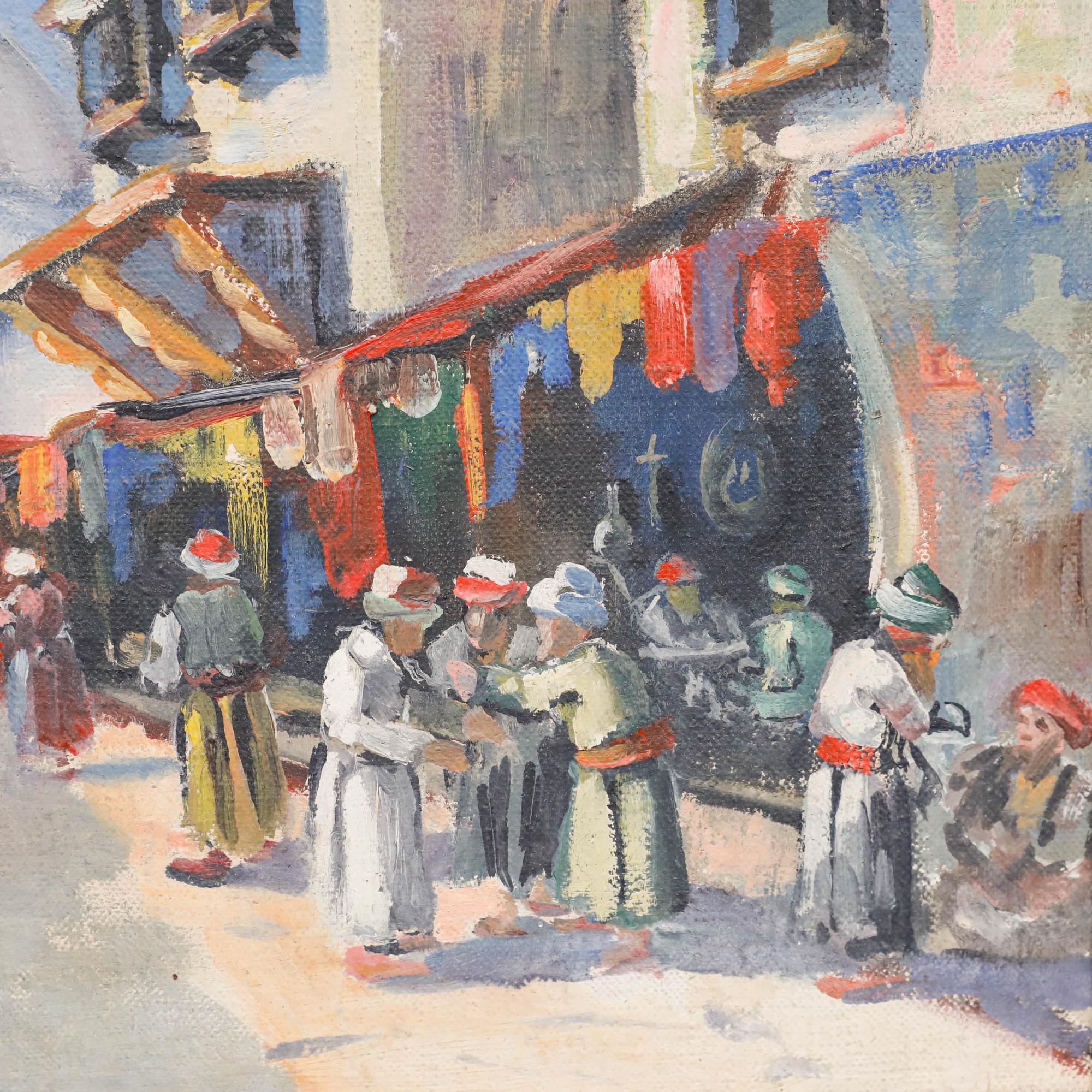 A vibrant 20th-century market scene, bathed in sunlight, capturing the rich colours and textures of an Eastern bazaar. Signed to the lower right, possibly 'Leon Schmitt'. Well presented in a silver painted frame. On canvas on stretchers.