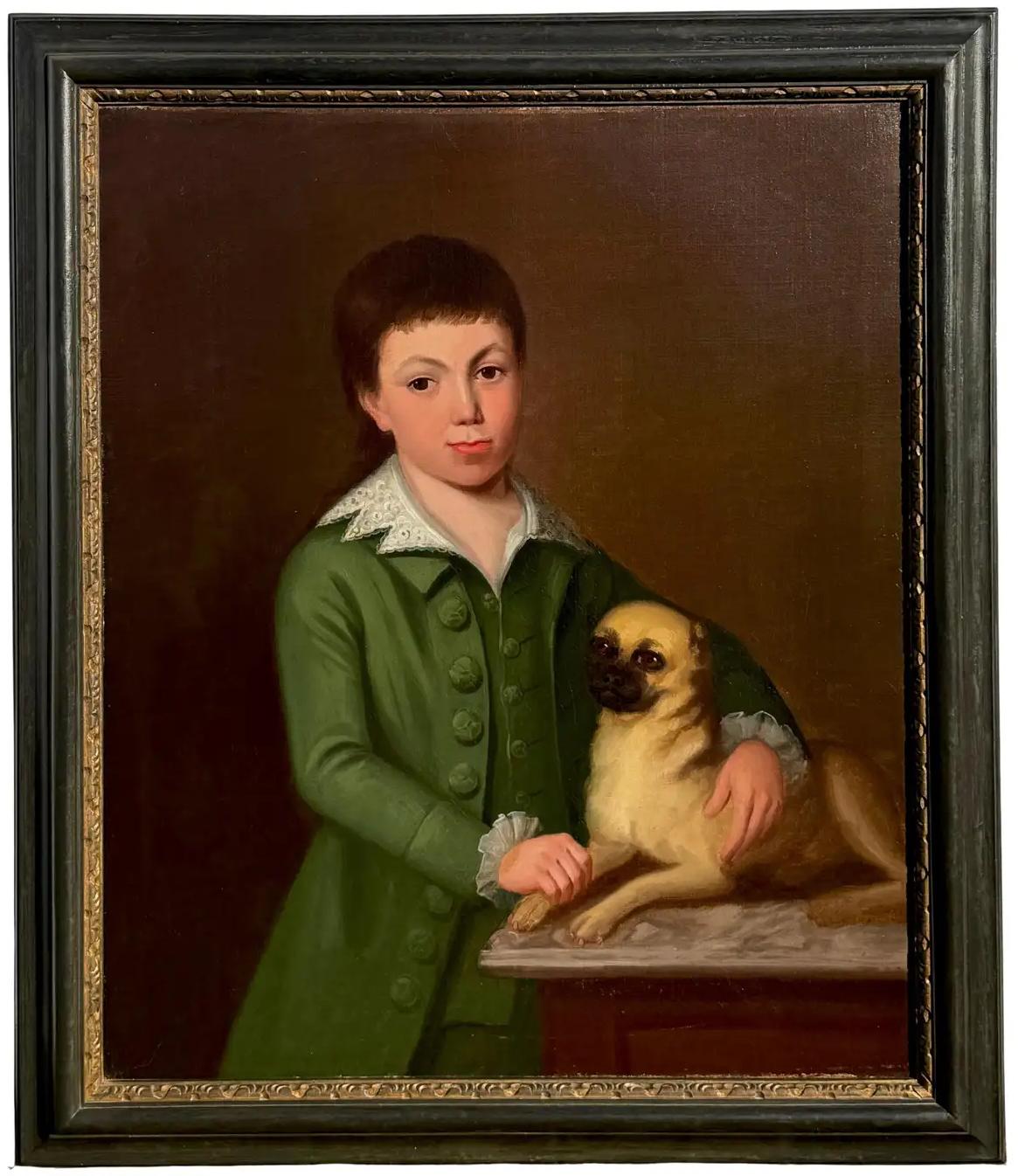 Un niño y su perro carlino
