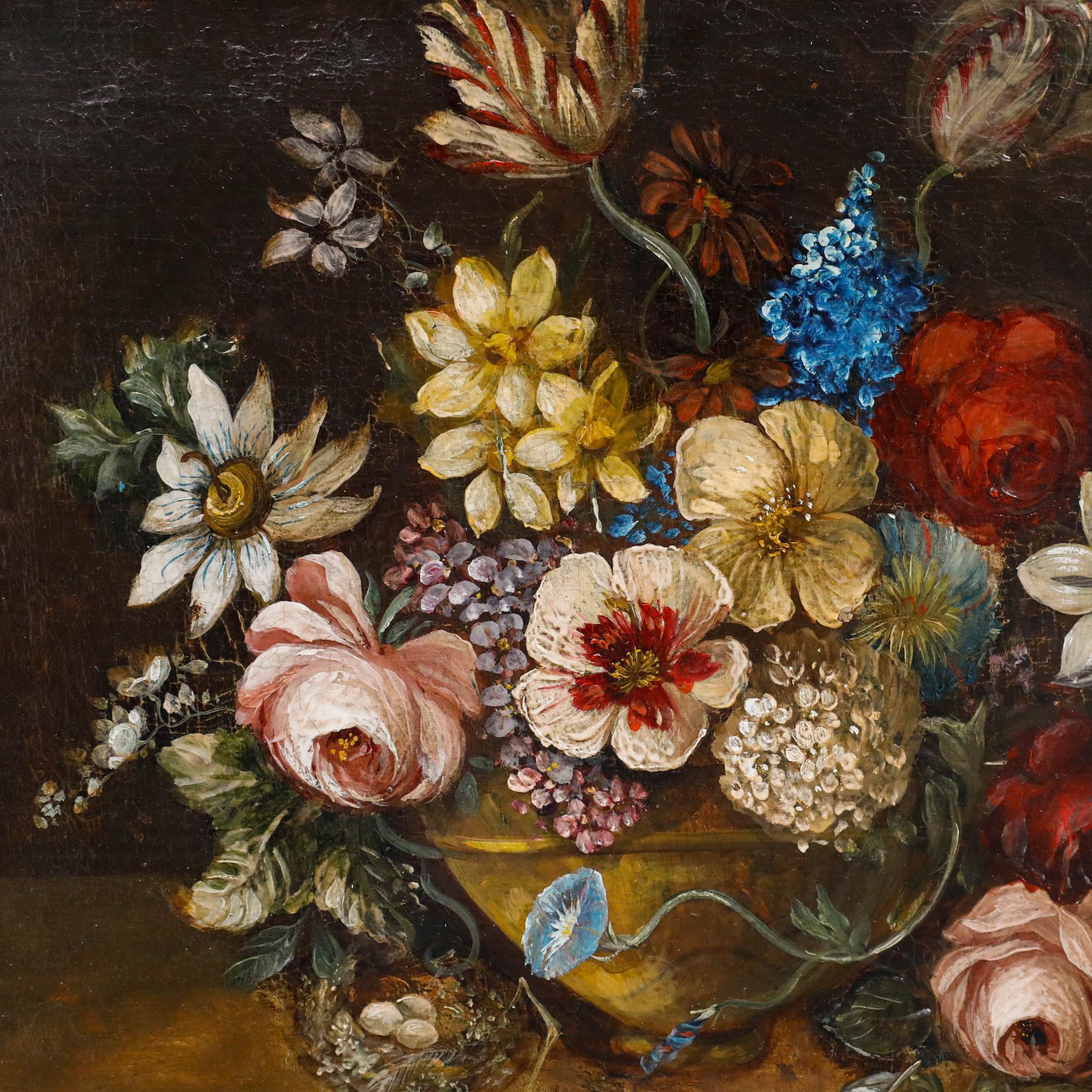 This classical still life painting features an abundant floral arrangement set against a dark background, showcasing a variety of blooms including roses, daisies, and other seasonal flowers in rich colours of pink, yellow, blue, and white. Signed to