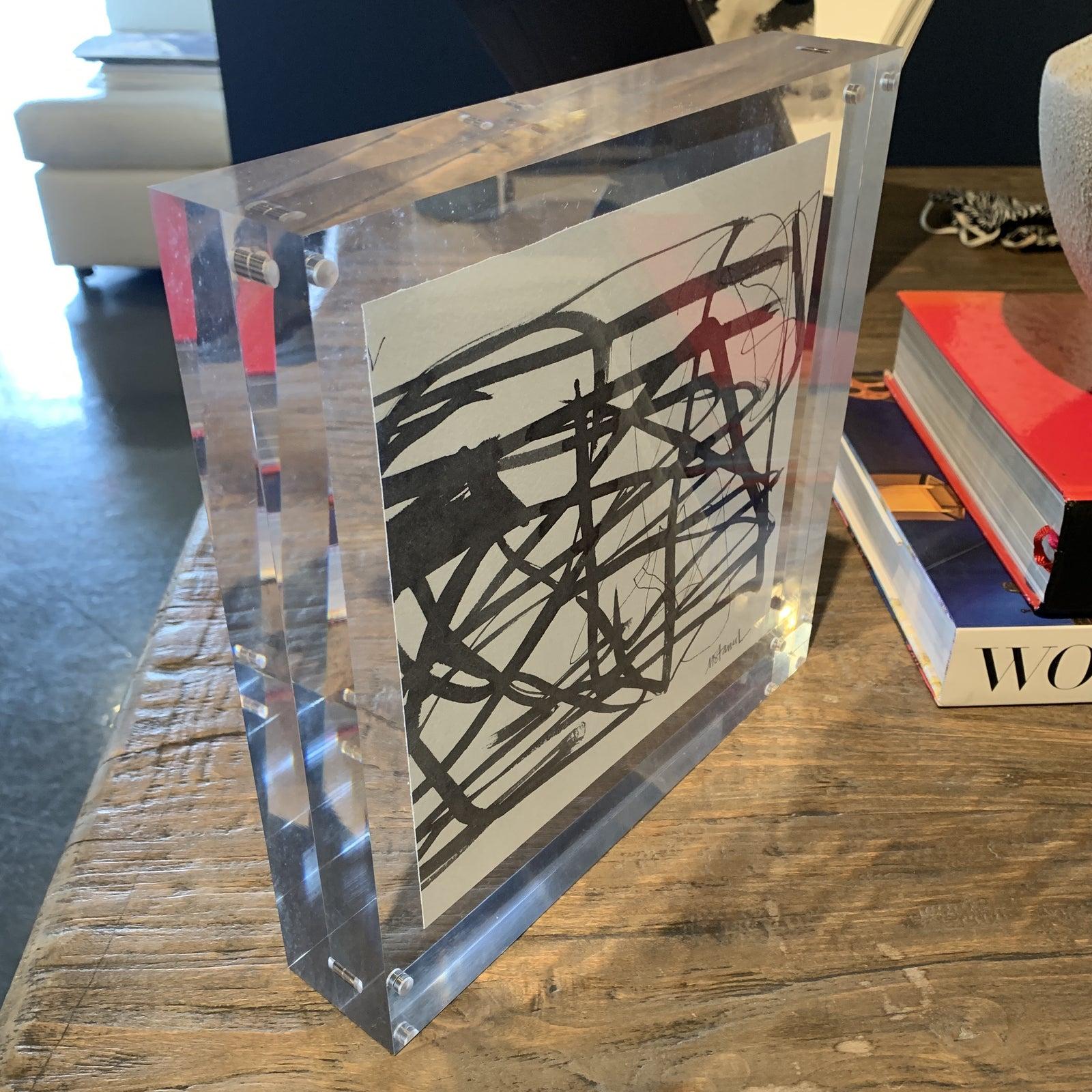 Artist : Michele Stancil 

10 x 10 Black and White abstract in very thick standing lucite 

Magnetic closure - the gallery has a collection of her work 