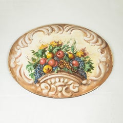 An Italian Decorative Oval Panel of Fruit and Flowers