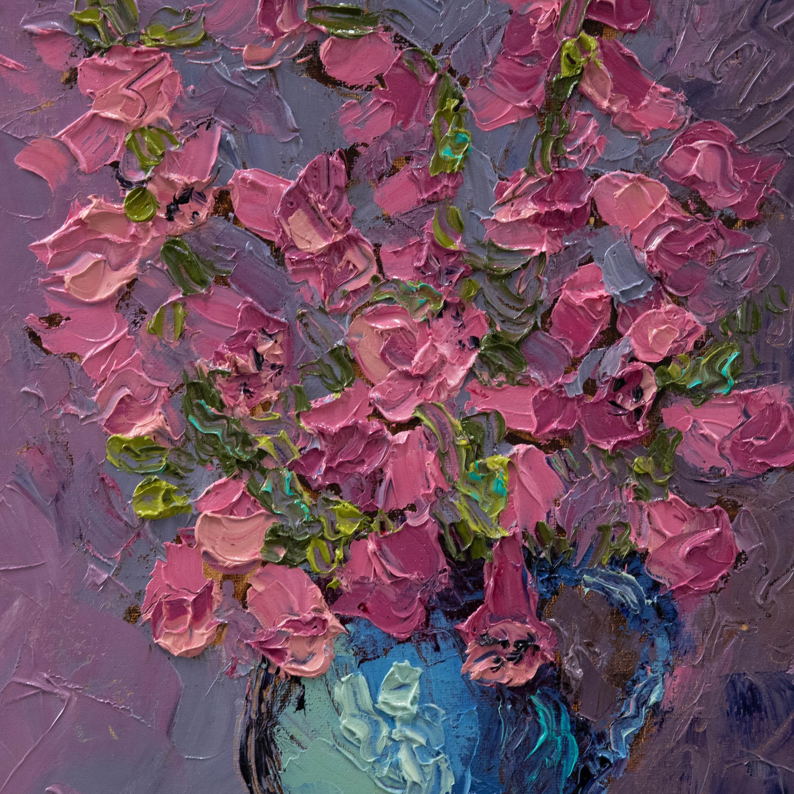 A striking still life study depicting foxgloves in a blue ceramic vase after an original by Nancy Kominsky. Signed, titled and dated to the stretchers verso. On canvas. 