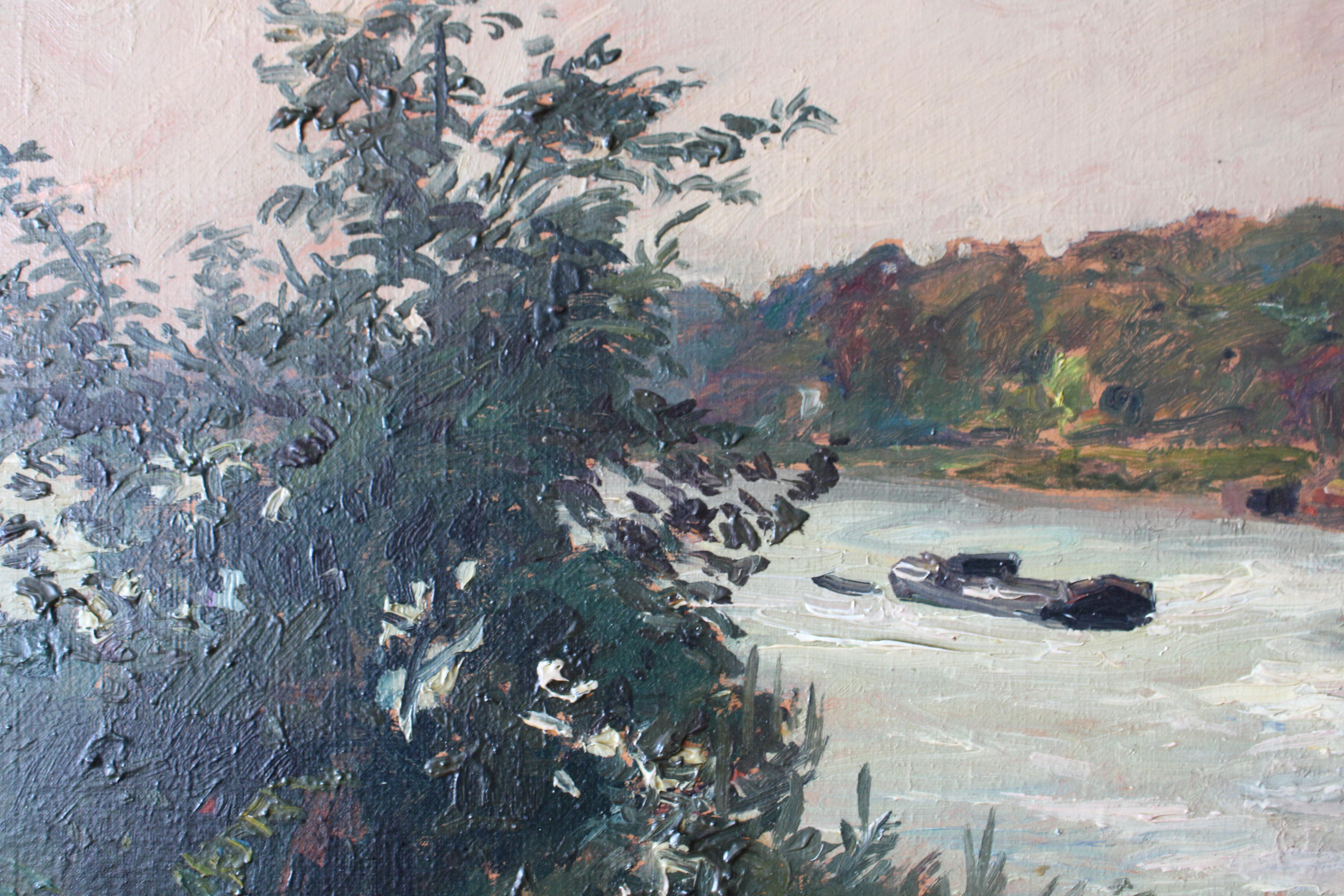 Antique French riverscape/landscape in a beautiful ornate frame, unsigned.  This attractive post-impressionist oil on canvas of a boat sailing down a river has the most appealing hues of greens, blues and lilacs with burnt sienna.  Here, the artist