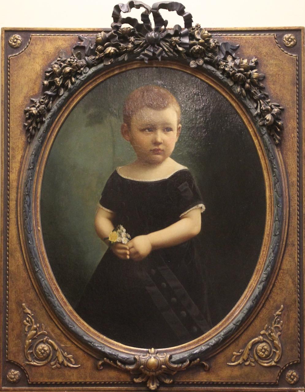 Pintura al óleo antigua. Retrato de niño con marco ornamentado.