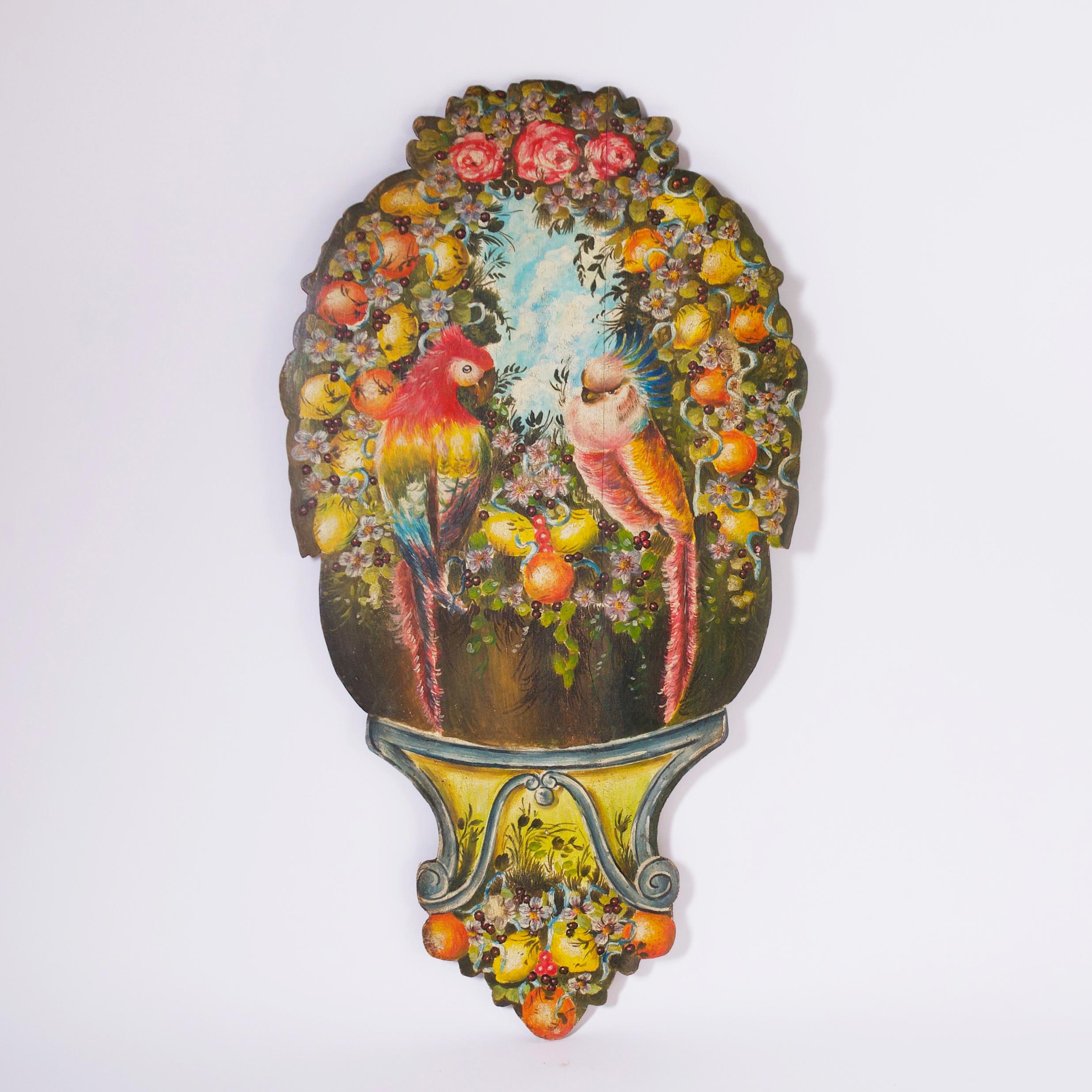 Charming 19th Century oil painting on boards cut to the shape of the painting depicting two parrots in a garden with fruit and flowers on a classical stand. 