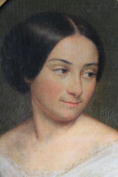 Antique oil portrait of a woman in an oval frame, 19th century portrait