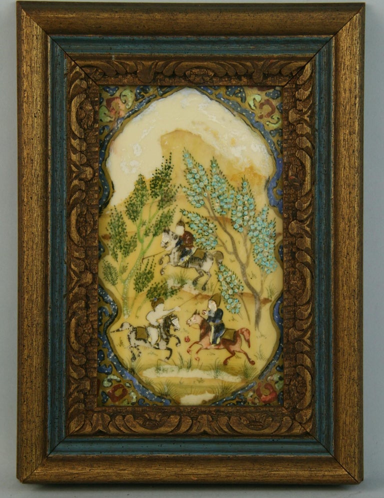 3965 Persian hunt scene landscape set in a hand carved wood frame
Image size 7.25x4.25
