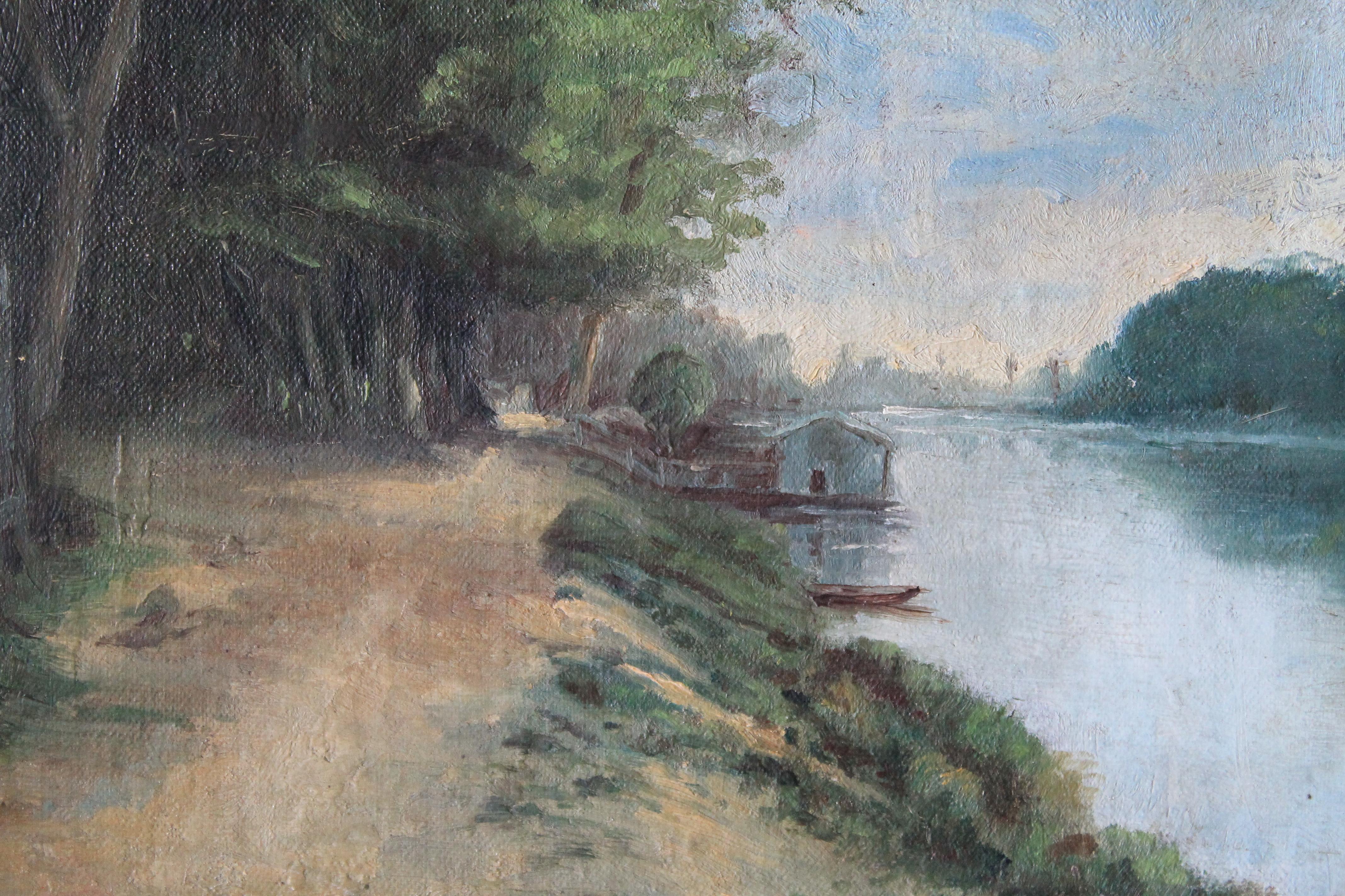 Late 1800's antique French riverscape/landscape oil painting.  This mellow and slightly moody old oil painting is on a canvas board.  Illuminated on the right by an open animated and stormy sky, reflected in the cool, calm waters of a river.  Your