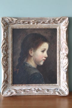 Antique sideways oil portrait of a young girl