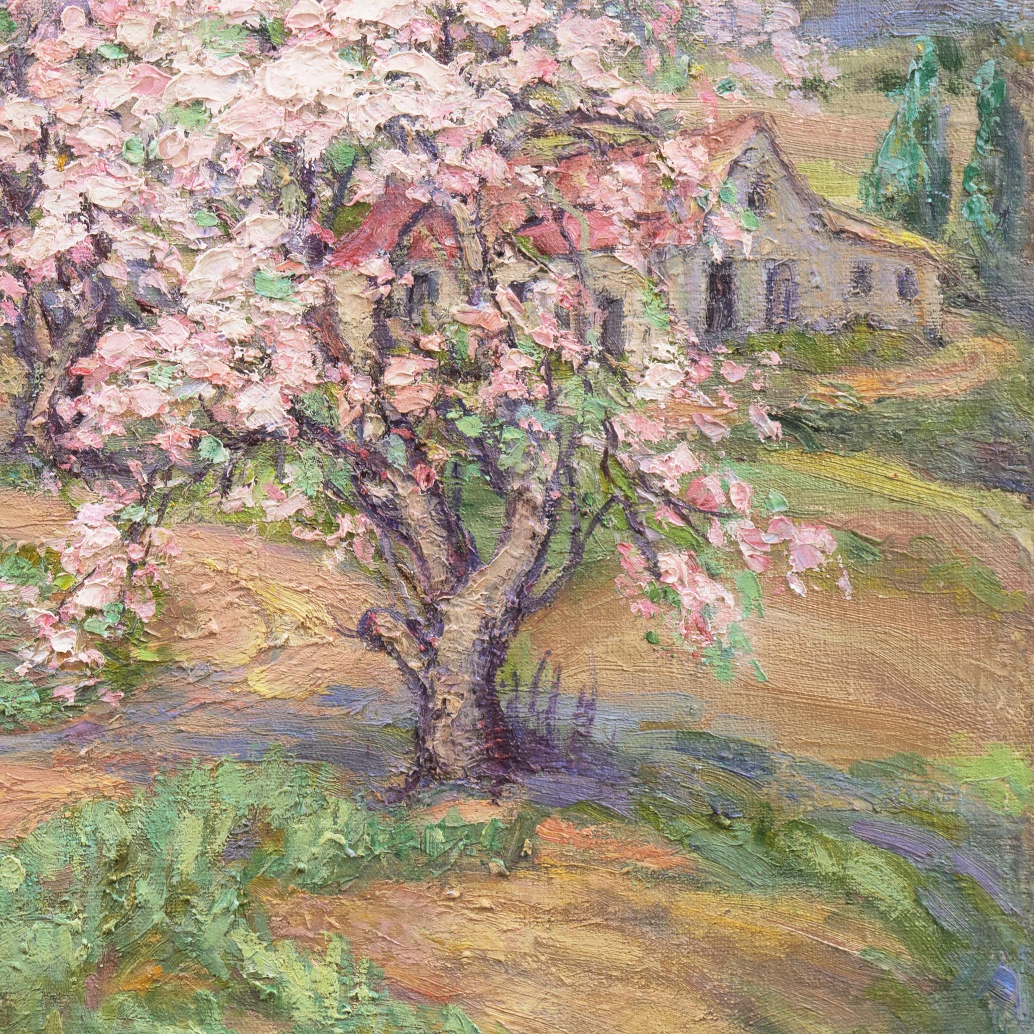 An intimate spring landscape showing a fertile valley with blossom-laden apple trees in the foreground  framing a red-tiled, stucco farmhouse and a view beyond towards distant hills.

Signed lower right, 'N.J. Martin' (American, 20th century) and