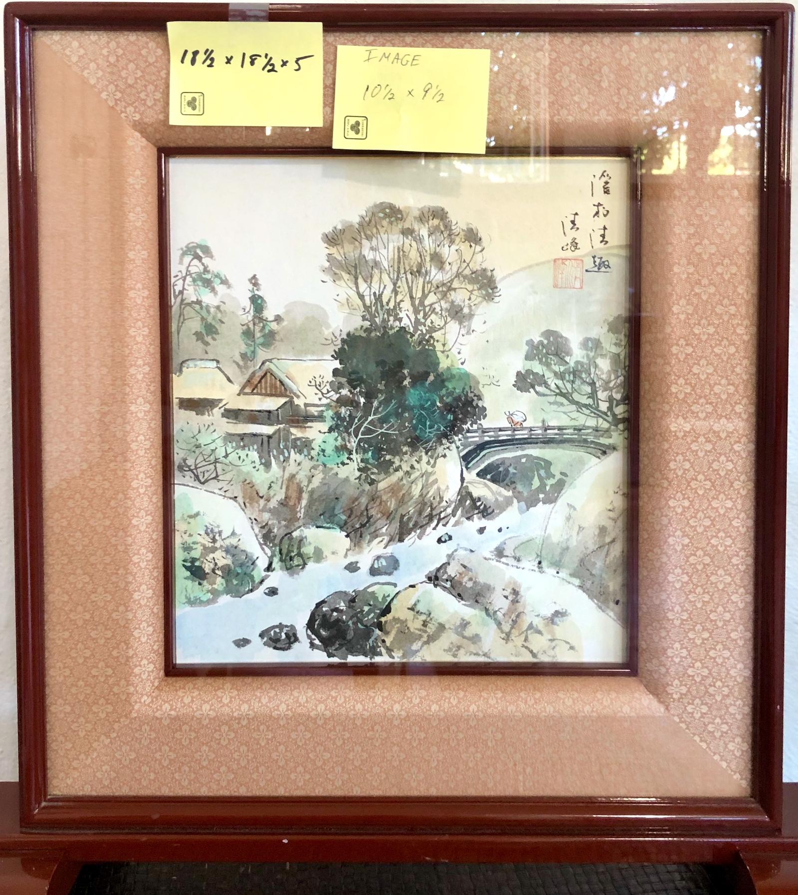 On offer is a framed watercolor depicting a country scene, from the architecture most likely in Japan. It appears to be just after the season’s first snowfall which lightly dusts the roofs, stream bed and surrounding boulders. One lone figure