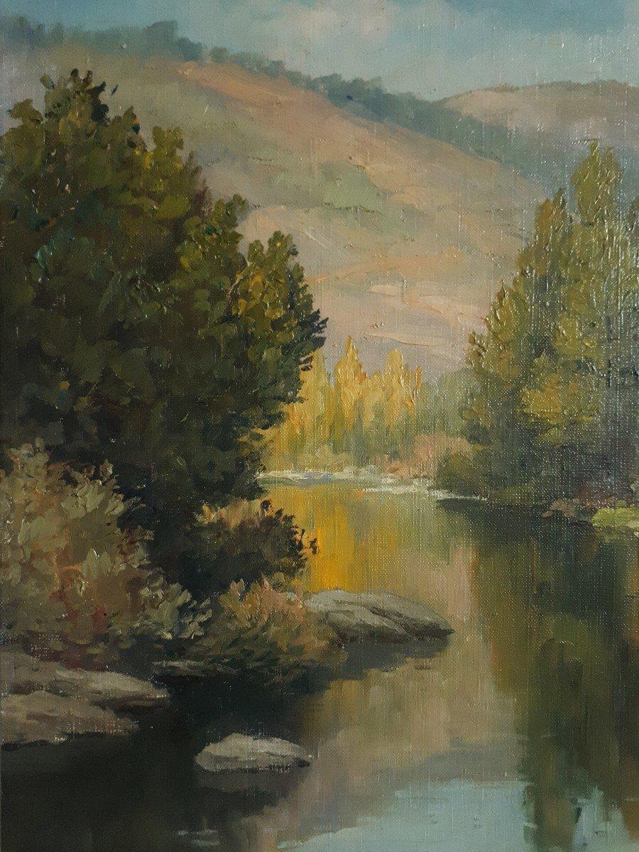 *The dimensions include the frame 

This serene oil on canvas landscape captures the tranquil beauty of fall in an Impressionist style. The artwork, with its loose brushstrokes and vibrant depiction of light, reflects the essence of Impressionism, a