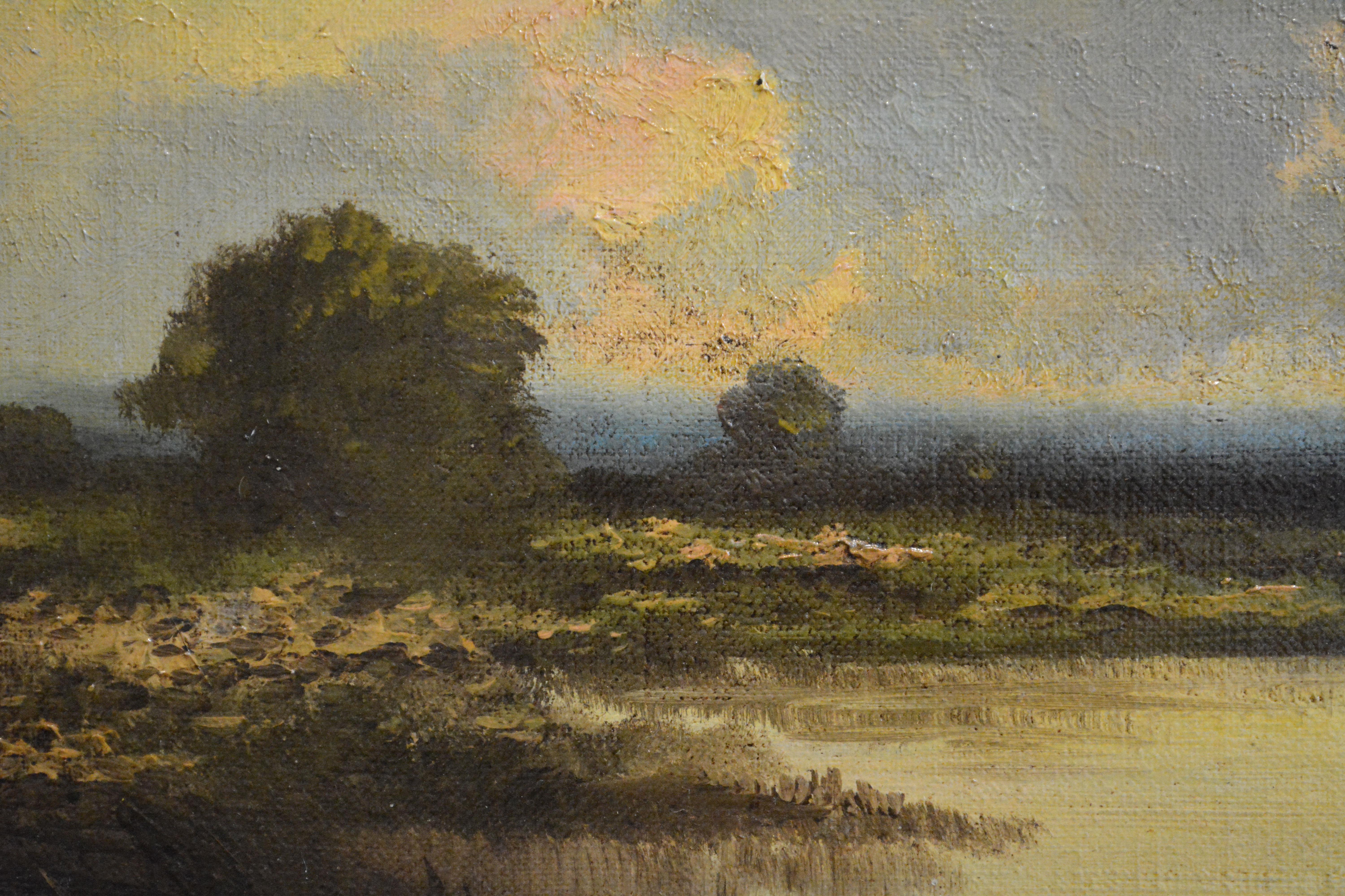 A moody, stunning Barbizon-style painting with the classic gloaming (or could it be a sunrise) golden light glowing behind a patch of forest and reflecting off a lagoon. It is unsigned, and curiously, it is painted on Masonite, meaning it was