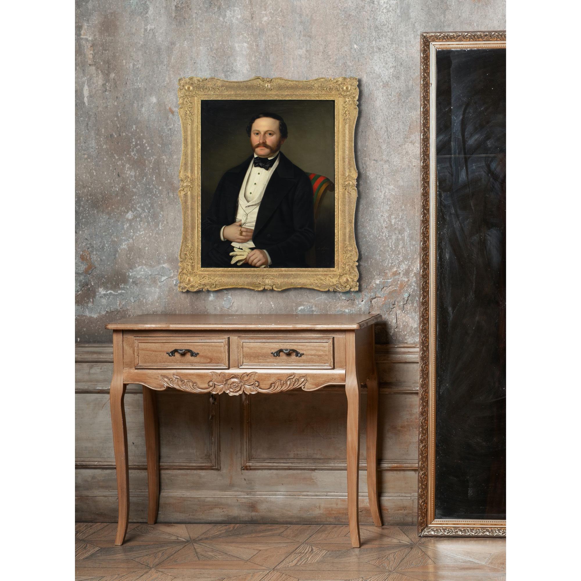 This charming early 19th-century oil painting by German artist Benno Fischer (1828-1865) depicts a seated gentleman wearing a black suit, white shirt, white waistcoat, and black bow tie. He’s holding a pair of white gloves.

Hailing from Dresden,