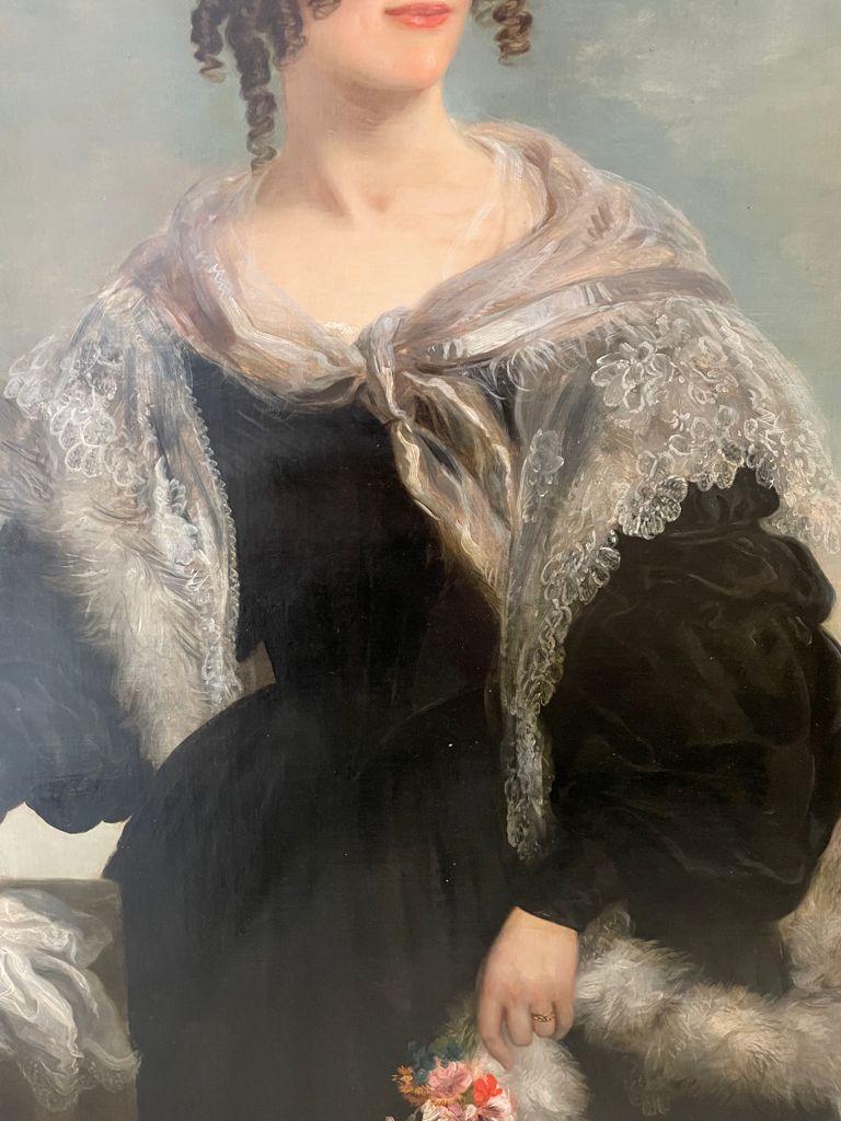 British school 19th century. Portrait of a Lady Holding a Spring Flower. - Black Portrait Painting by Unknown