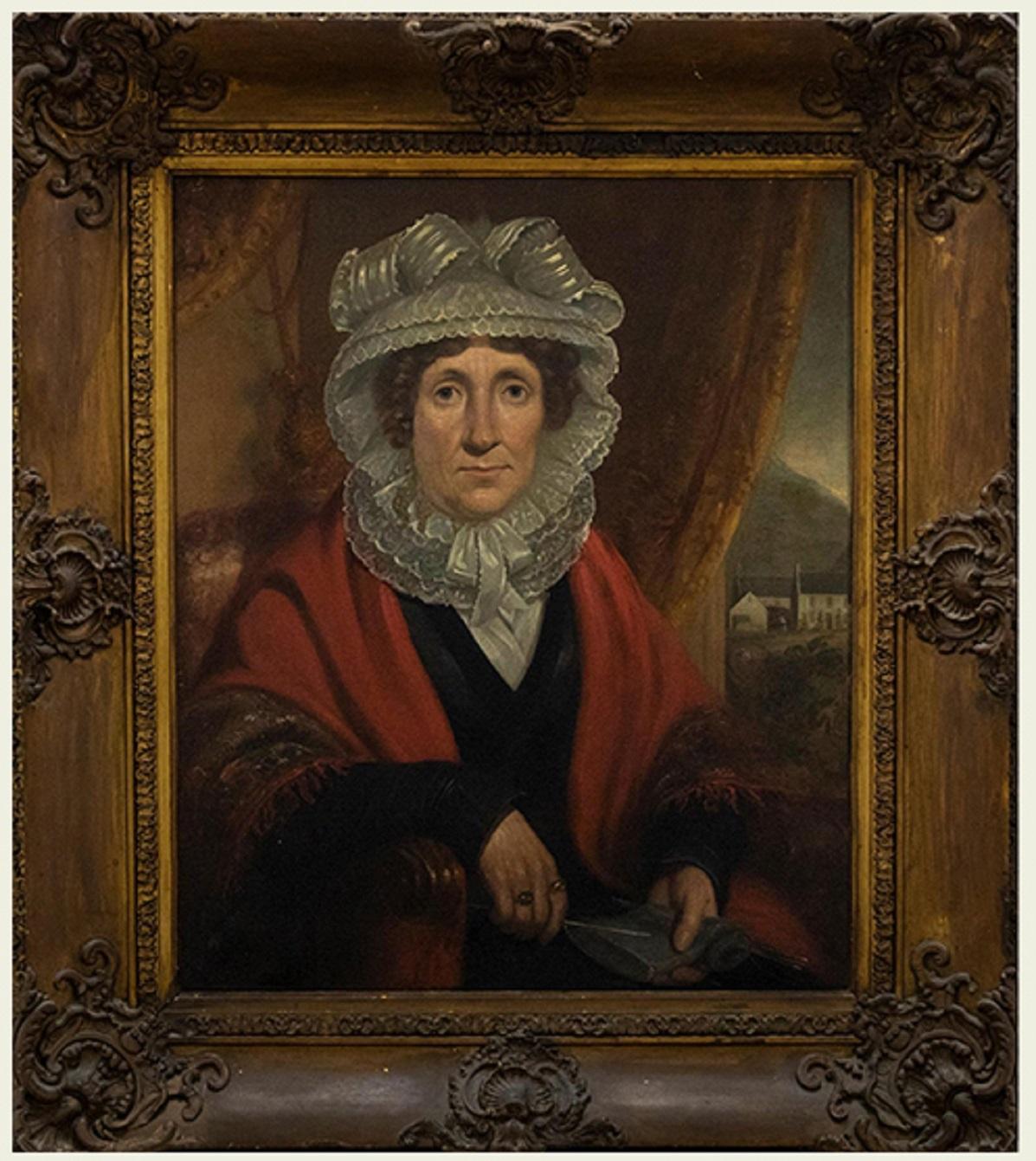 Ein wirklich einzigartiges und auffälliges Porträt aus dem 19. Jahrhundert, das eine auffällige Frau mit einem leuchtend roten Schal und einer kunstvollen Spitzenhaube zeigt. Der reiche Wandteppich an den Ärmeln ihres Schals, die zarte Spitzenarbeit
