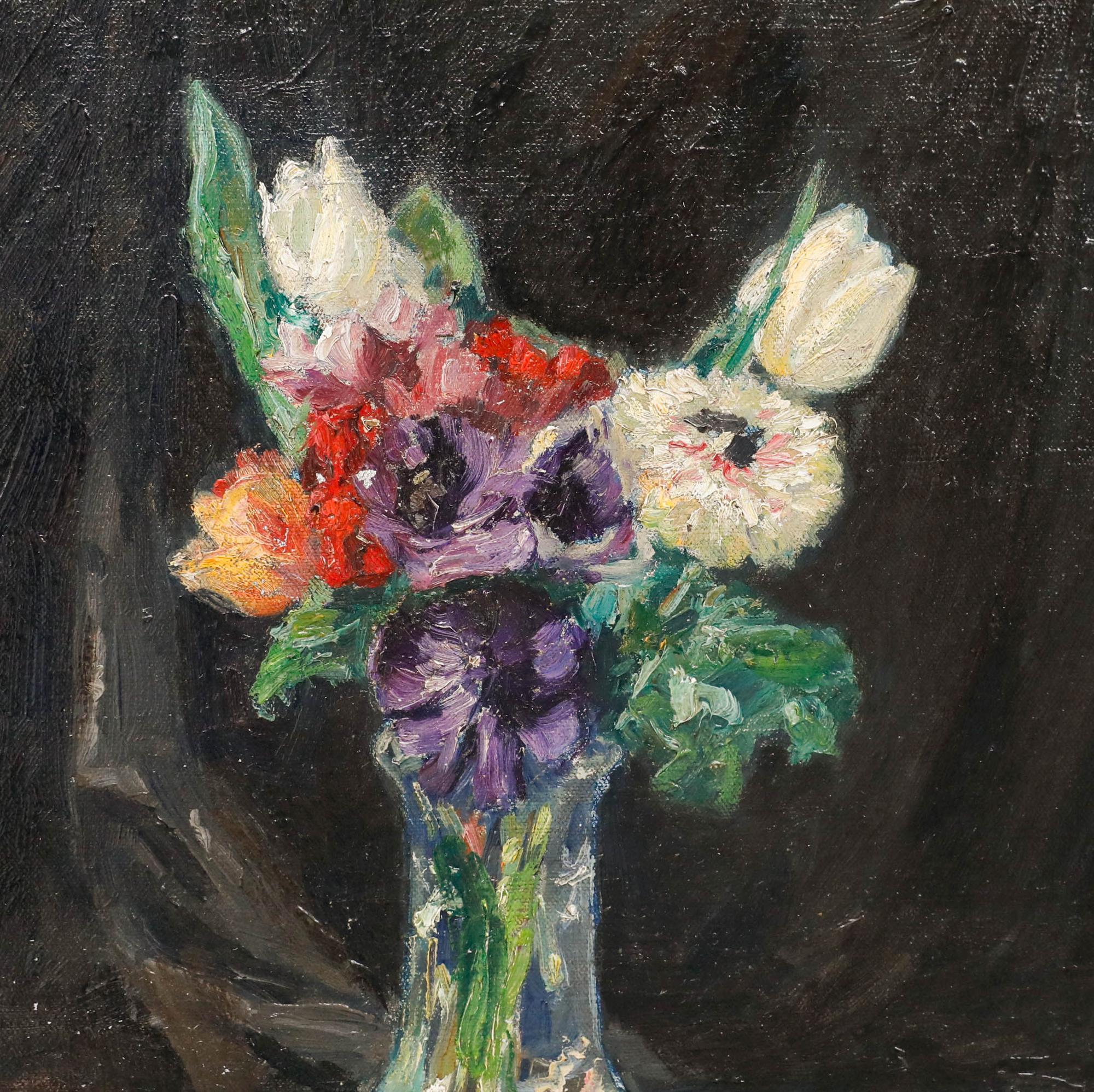 This striking still life composition depicts a glass vase filled with freshly cut tulips, anemones, and irises. The artist uses loose, expressive brushwork to capture light playing across the glass and colourful petals, with the arrangement resting