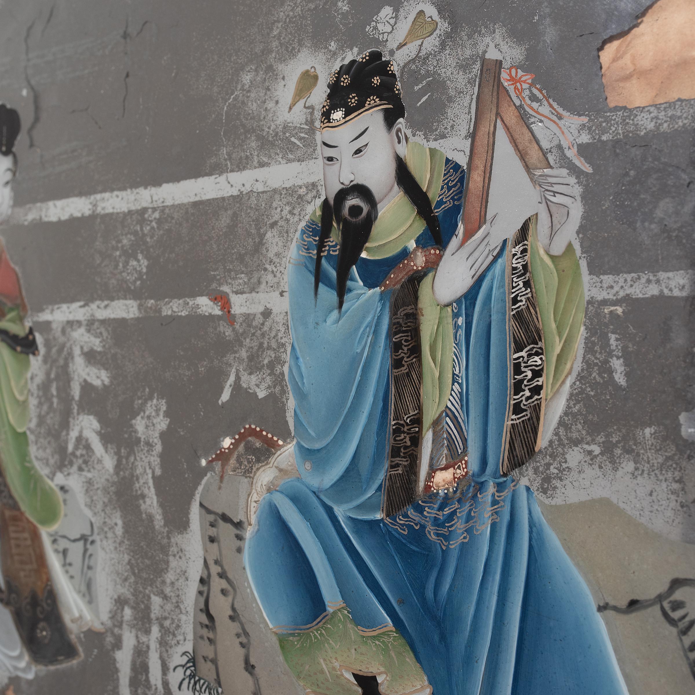 Popularisée sous la dynastie Qing, la peinture sur verre à l'envers exige de l'artiste qu'il travaille essentiellement à l'envers, en commençant par les détails et les ombres avant d'ajouter la couleur et la forme. Cette technique exigeante, qui ne
