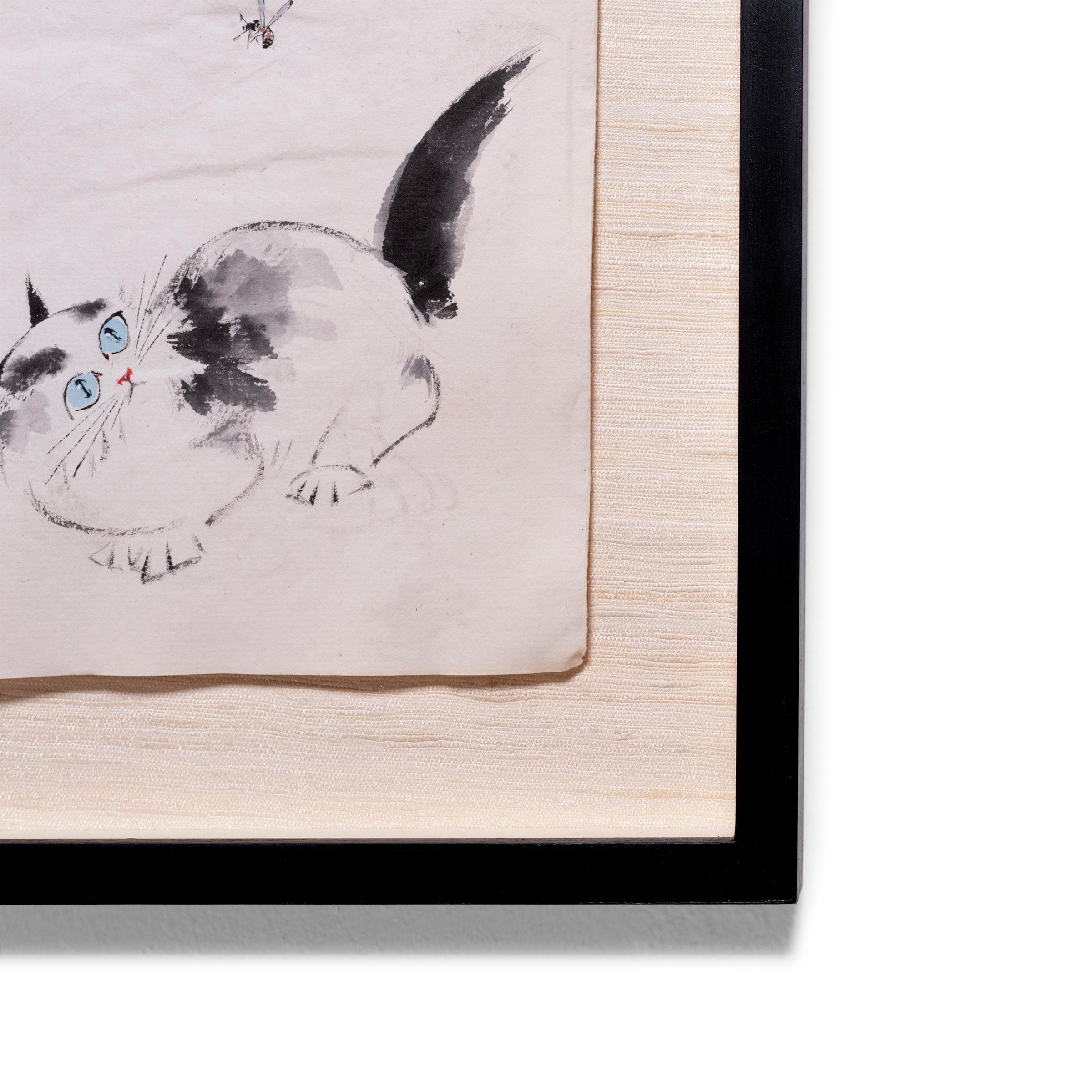 This charming ink painting is a contemporary example of the traditional art of calligraphy painting. With a careful hand, the artist uses just a few brush strokes to capture the playful nature of a curious kitten, crouched on all fours and peering