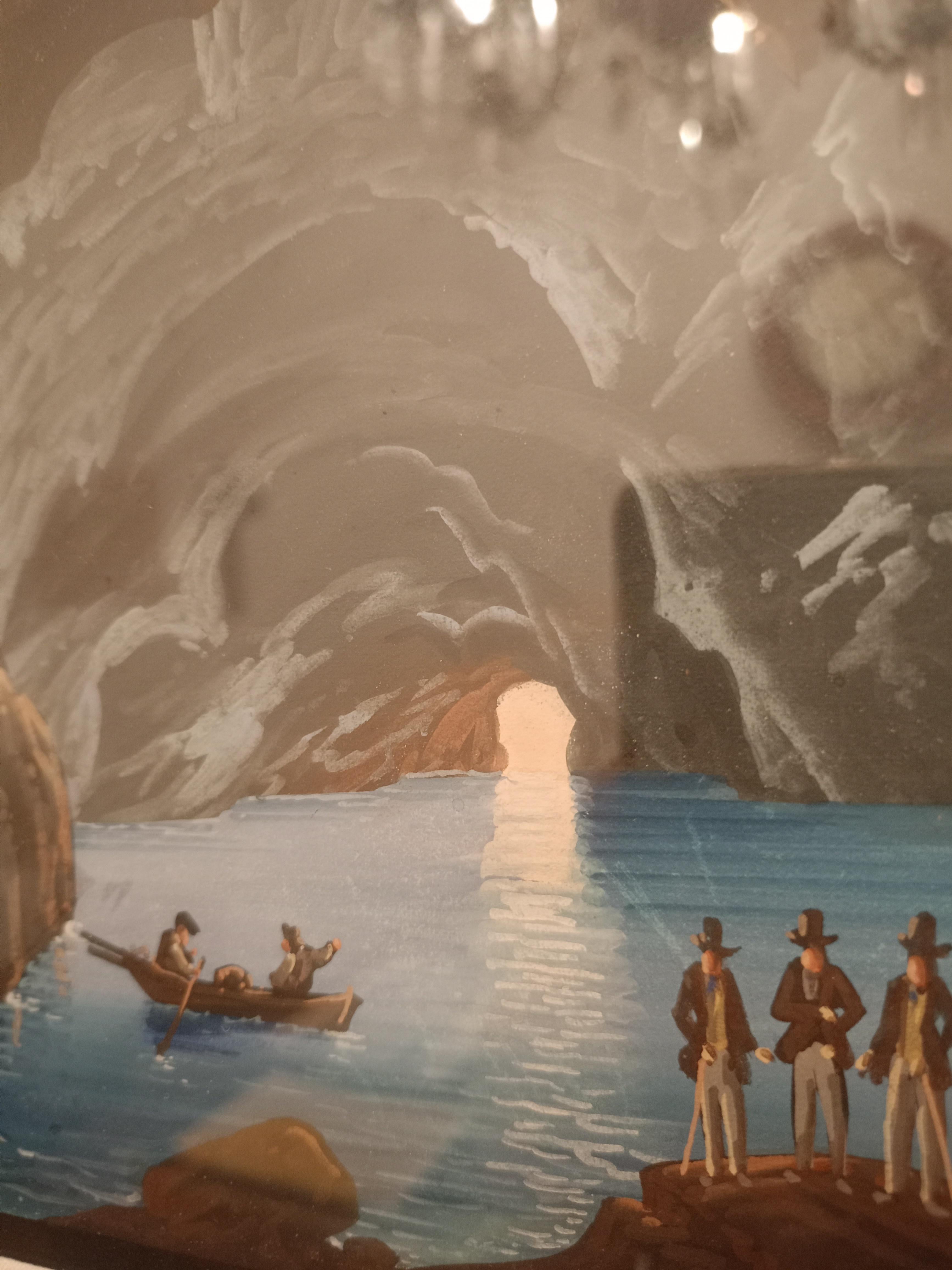 Antique Neapolitan gouches with coeval frame belonging to the early 20th century.

The scene depicts Capri's famous grotto as seen from the deepest point.

Providing a perspective background are four attentive men looking at the beauty of the cave