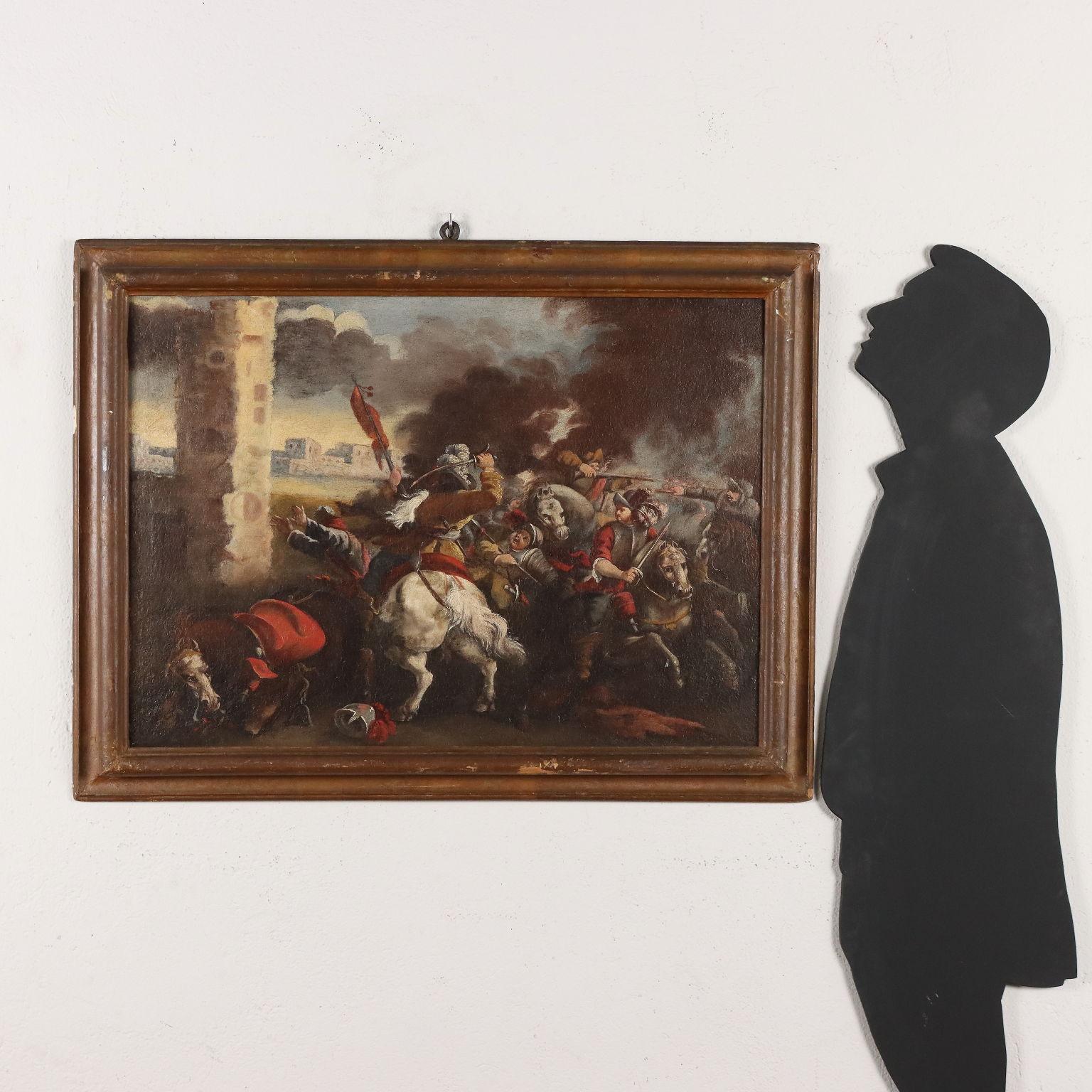 Oil on Canvas. Northern Italian school of the 17th-18th century. The scene features a clash of knights outside the walls of a besieged city, with smoke from firearms invading the sky. Restored and re-tinted, the painting is presented in adapted