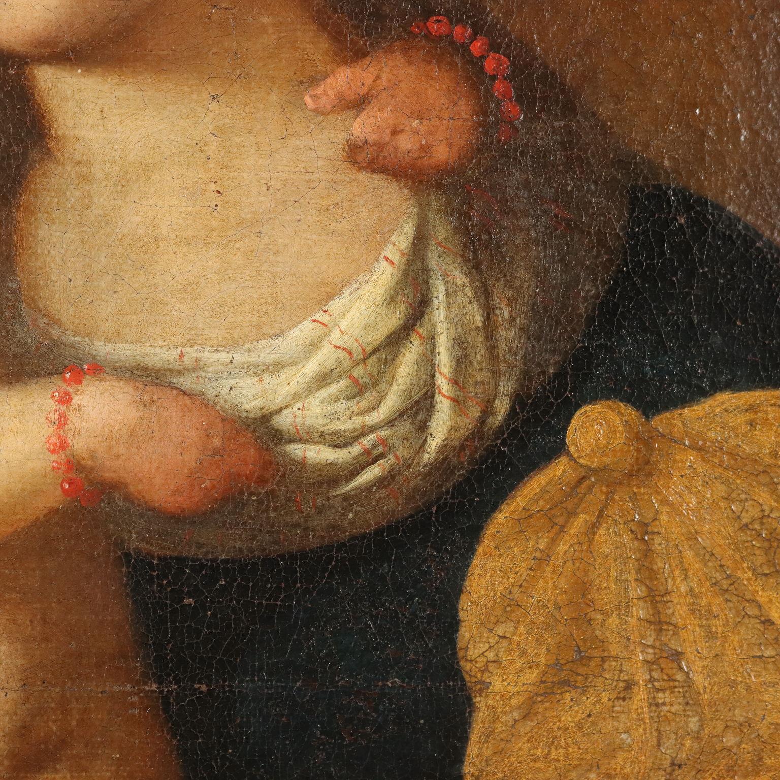 Olio su tela. Scuola italiana del XVII-XVIII secolo.
Maria e il Bambin Gesù, in piedi sulle sue ginocchia, sono raffigurati già nella gloria dei cieli, con angioletti accanto.
Peculiari sono la collana e i braccialetti di corallo portati dal