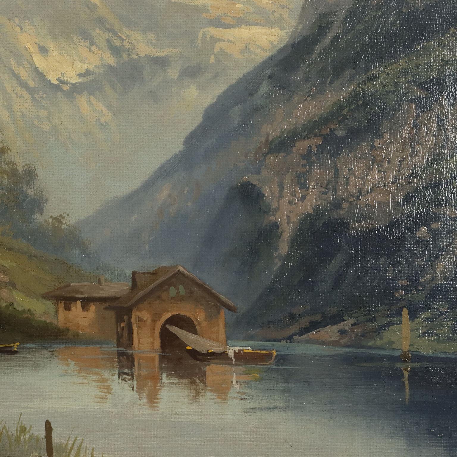 Olio su tela. Scuola centro-europea della prima metà del '900.
Firma  non identificata in basso a sinistra.
In un'ampia vallata sotto cime montuose aguzze, si apre un laghetto, sul quale si affacciano alcune abitazioni e navigano barchette; alcune