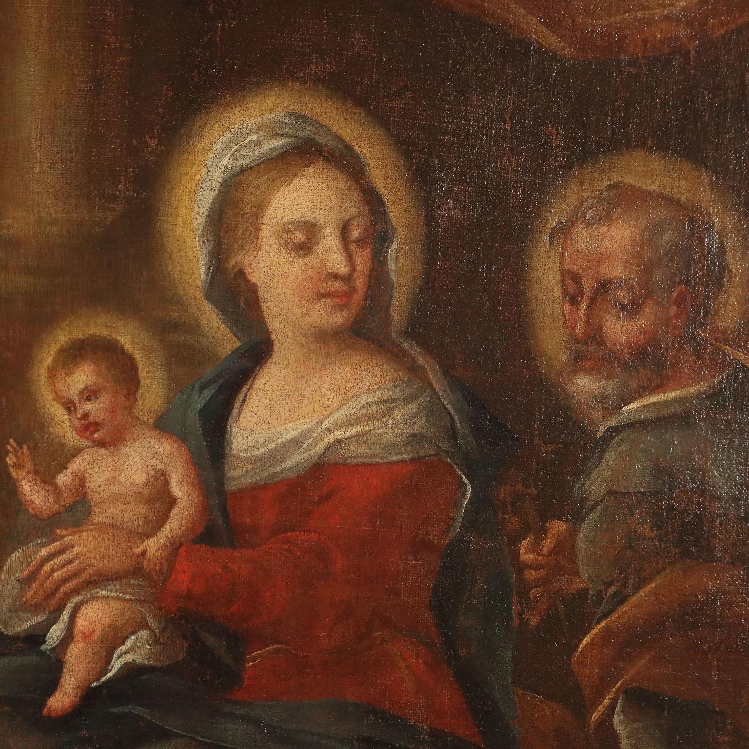 Olio su tela.
La scena raffigura la Sacra Famiglia accompagnata da San Giovannino ed un altro santo inginocchiati davanti al Bambin Gesù, che conversa con loro seduto in grembo alla madre; Maria è invece girata all' indietro, ad osservare il lavoro