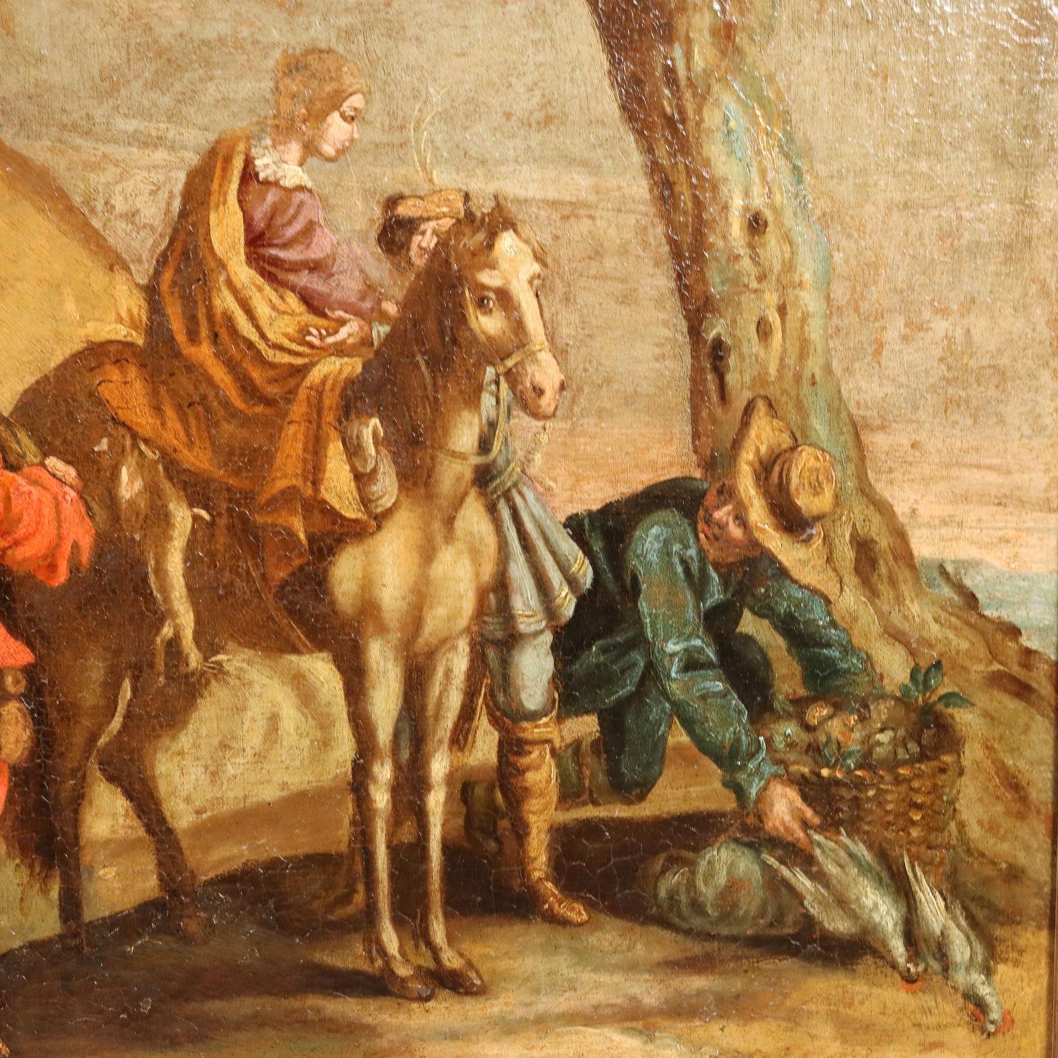 Olio su tela. Scuola nord-europea del XVIII secolo.
Nei pressi di un  piccolo aggregato di edifici, lungo la strada sterrata, si svolge una scena di vita popolare, animata da diverse figure: in primo piano a destra due cacciatori offrono le loro
