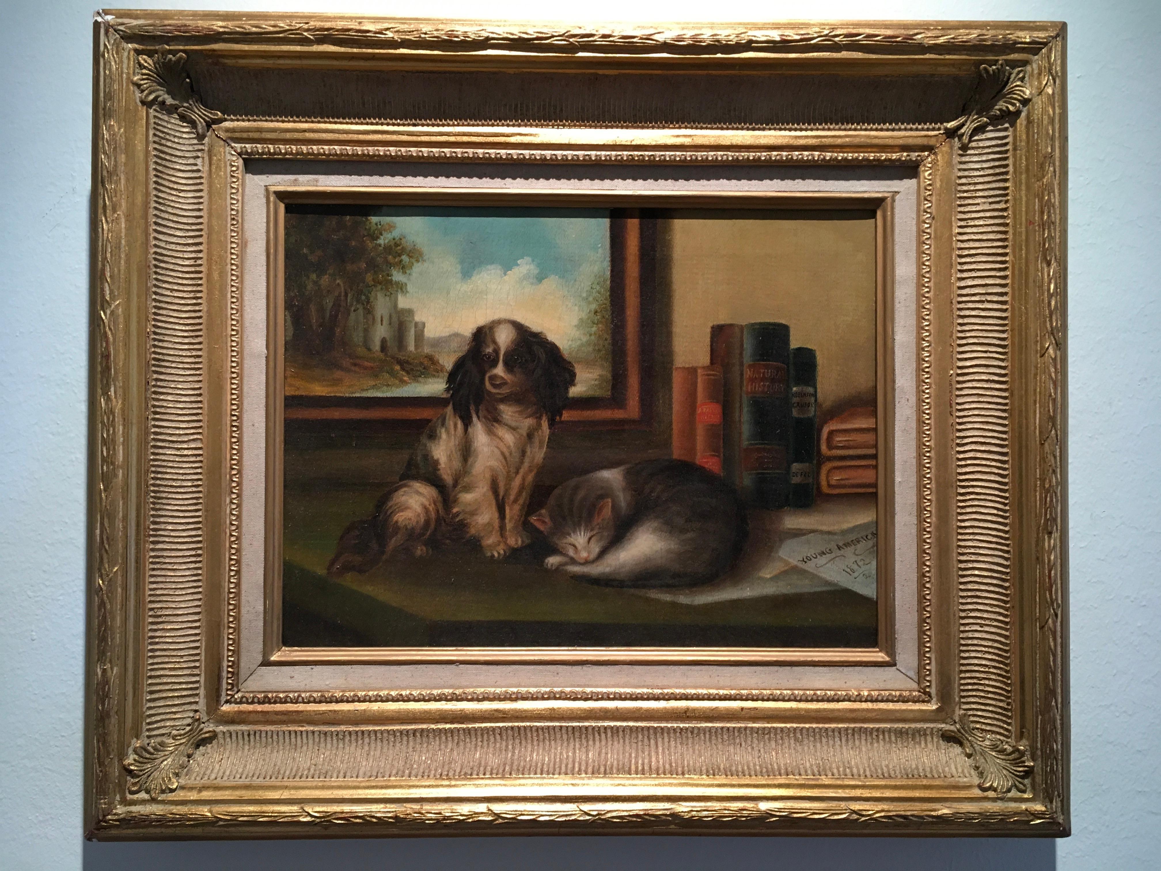 This classic English school 12 x 16 in. Oil on Canvas framed painting features a pet Spaniel and cat resting on a desk in a home study environment. The dog is seated, its body facing the right side of the painting while its head is facing the viewer