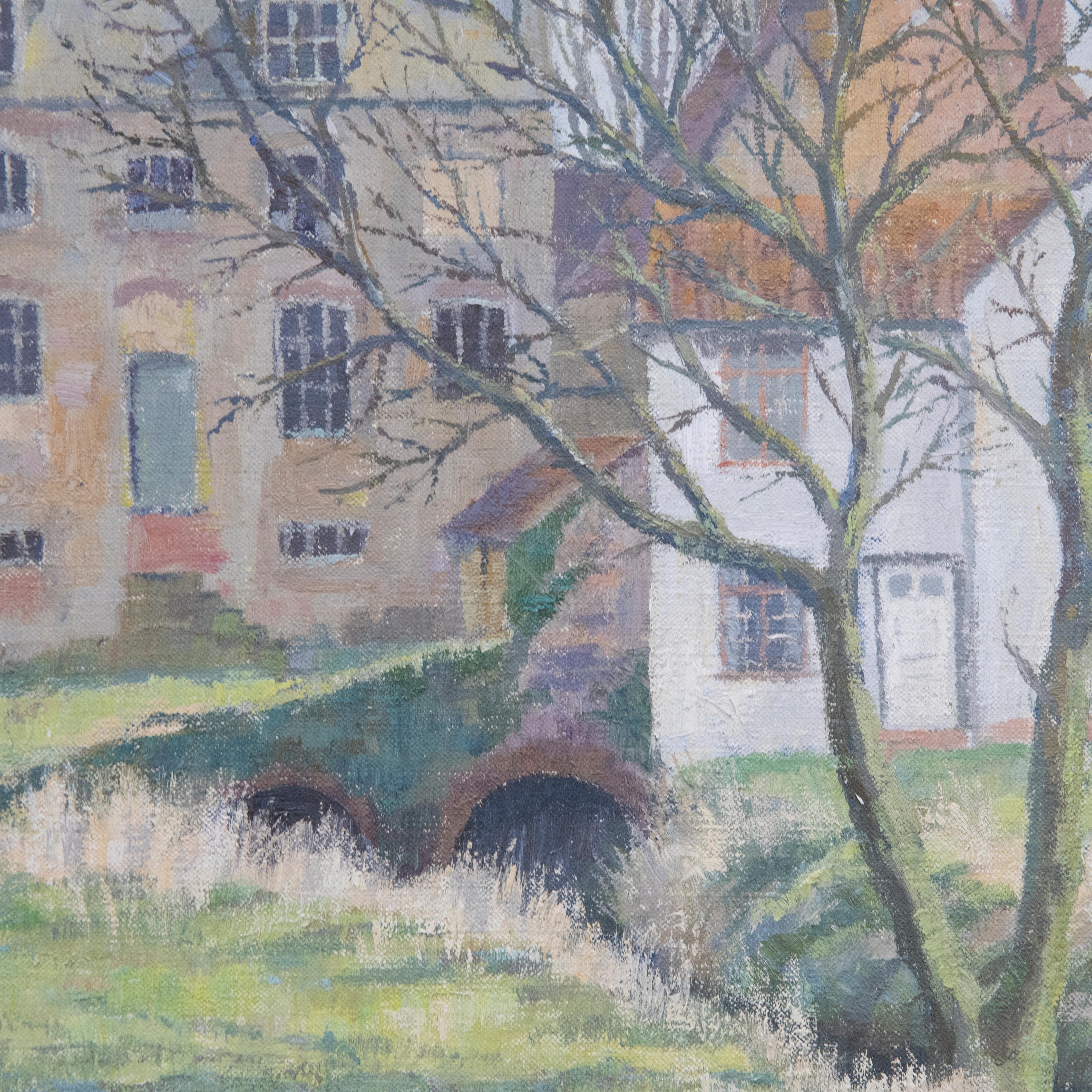A delightful depiction of an old watermill in Stone, Gloucestershire. The artist captures the quaint winter scene in a muted palette, showing the stone building surrounded by grassy banks and bare trees. Signed and titled verso. Presented in a