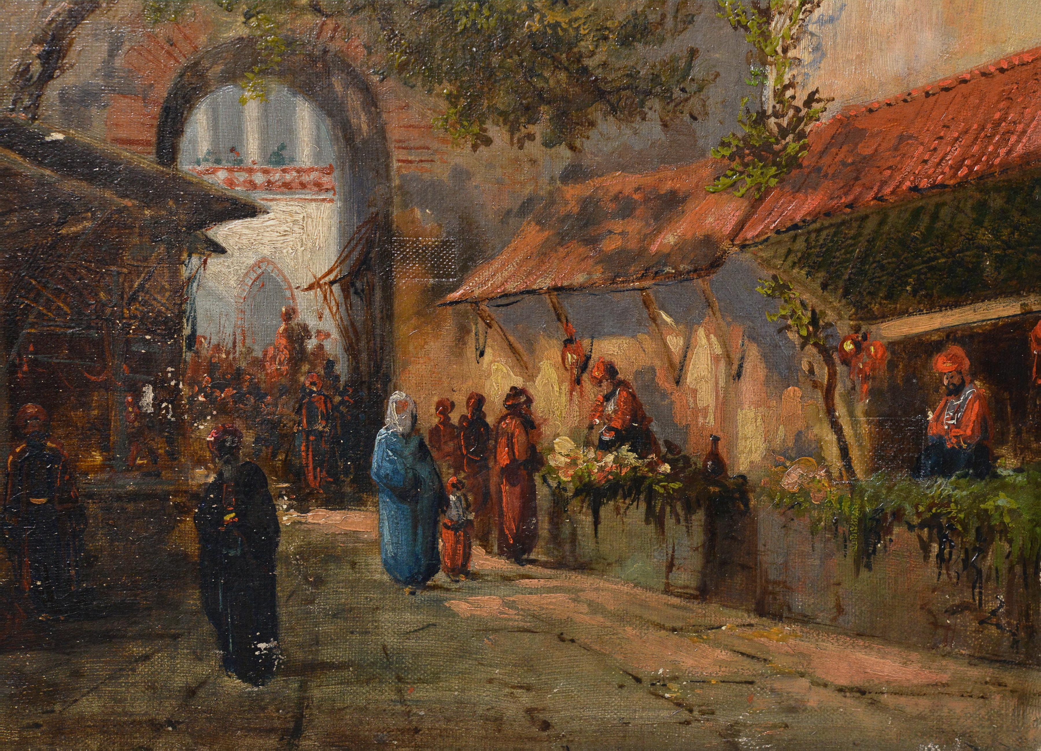 This evocative orientalist oil painting captures the vibrant atmosphere of a North African marketplace in the early 1900s. The painting depicts a street with a perspective toward a tall mosque dome and a striped minaret, rising against the