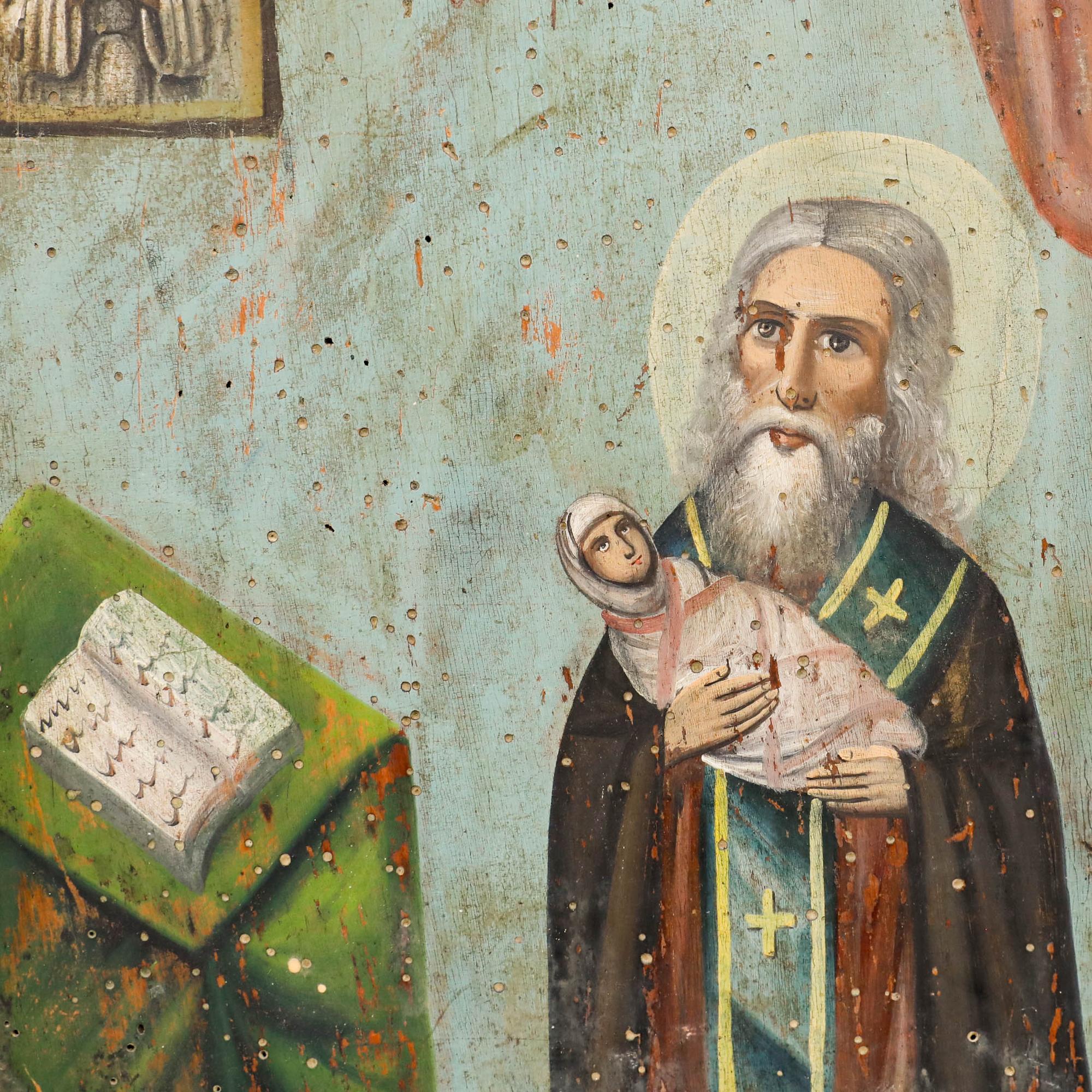 A naïve oil depicting St Stylianos, patron saint of children. This particular iconography is well known in the Orthodox Church in eastern Europe. Bears signature to the lower right. On panel. 