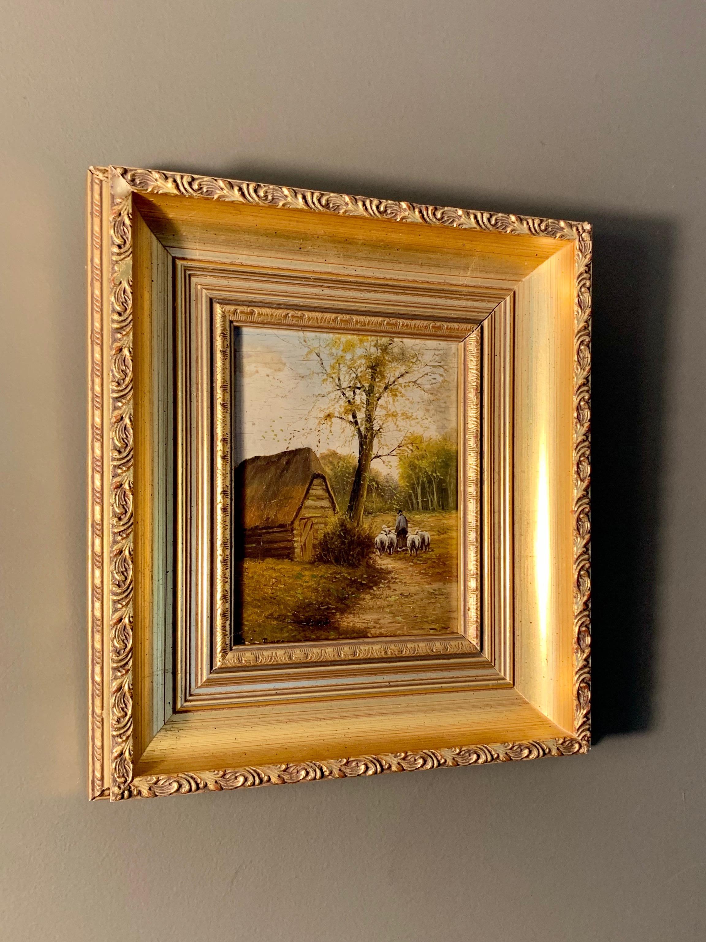 Petite French Barbizon school painting showing a shepherd guiding his herd in a wooded landscape. This peaceful little painting is housed in a matching gild frame from the period.
