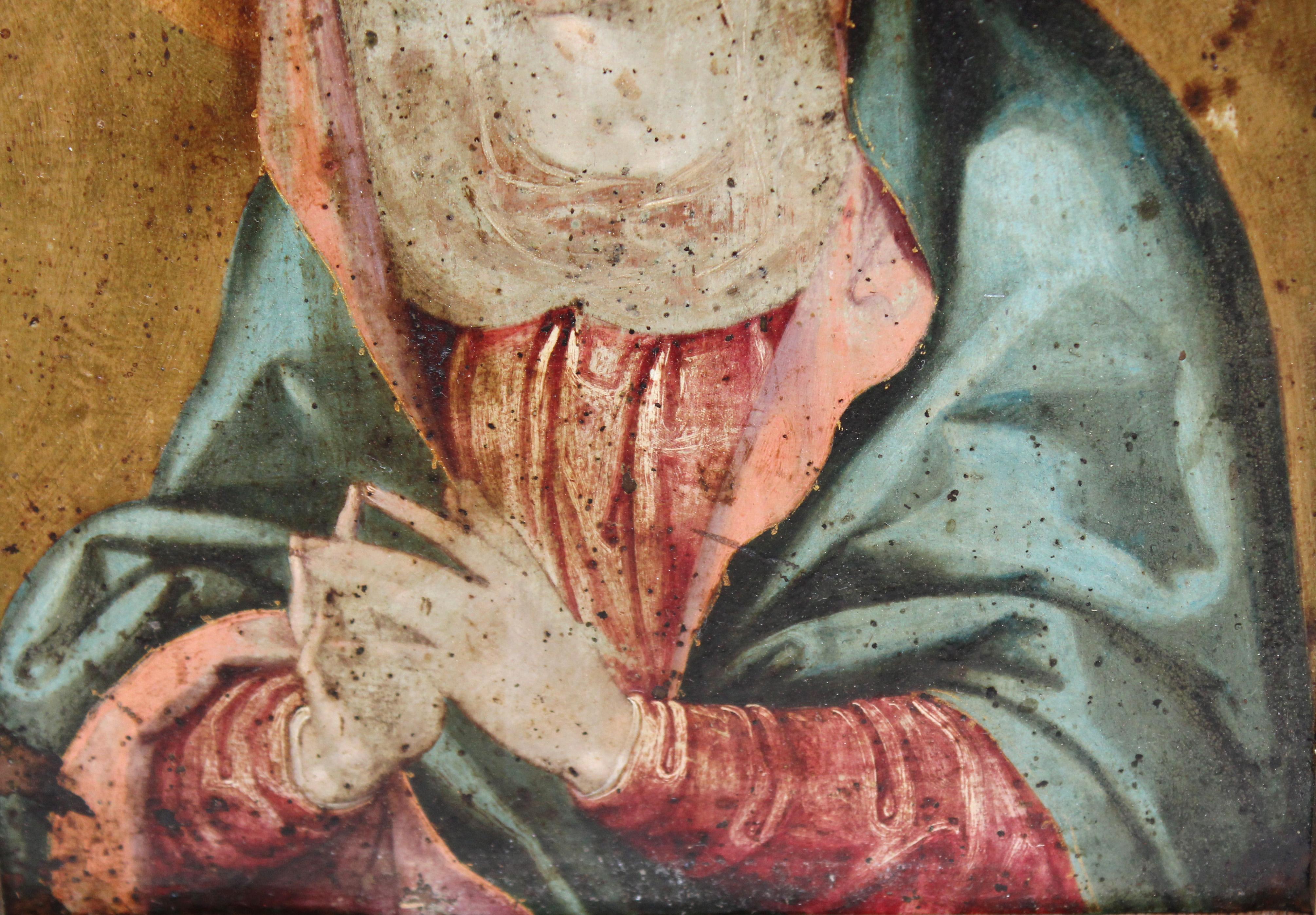 Die Malerei stellt die Jungfrau Maria in ihrer traditionellen Ikonografie dar. Sie sehen einen grünen Mantel, der ihren Oberkörper und ihre Hüften bedeckt, und ein rosafarbenes Kleid mit klaren Details. Sus manos están juntas in actitud de oración,