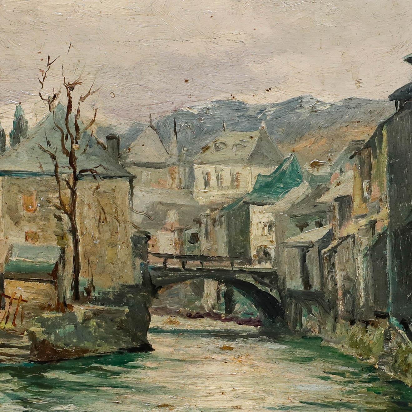 This atmospheric oil depicts Cierp-Gaud in southwestern France. The artist has captured the scene, with its flowing river, rustic buildings lining its banks and a bridge spanning the water. Signed to the lower right. Inscribed verso. On board. 