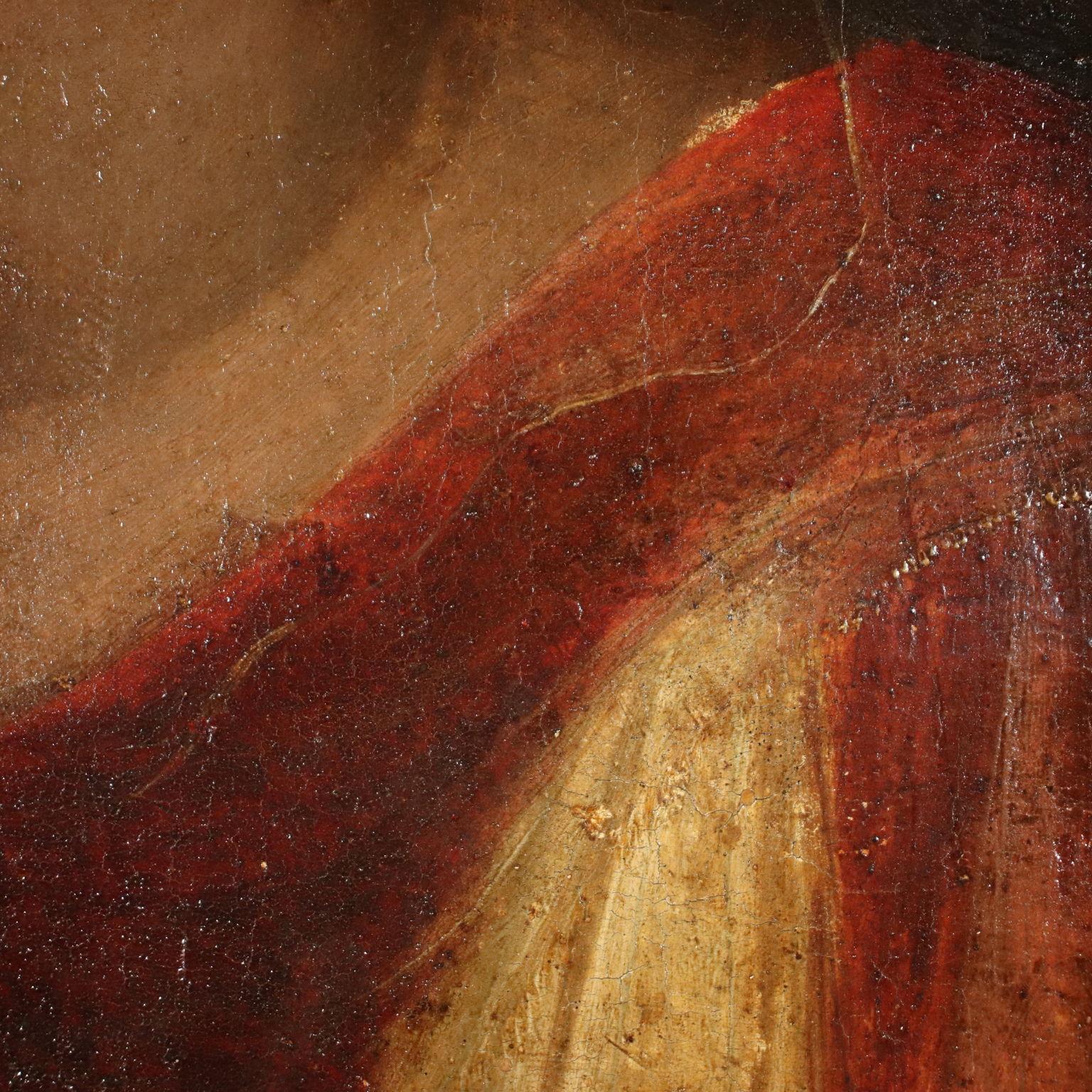 Tempera on wood depicting a half-length female figure;
she wears a red dress over a light-colored tunic, while a
green drape rests on her right shoulder. The red hair is
tied up with a central parting and is partly covered by a
white headdress; the