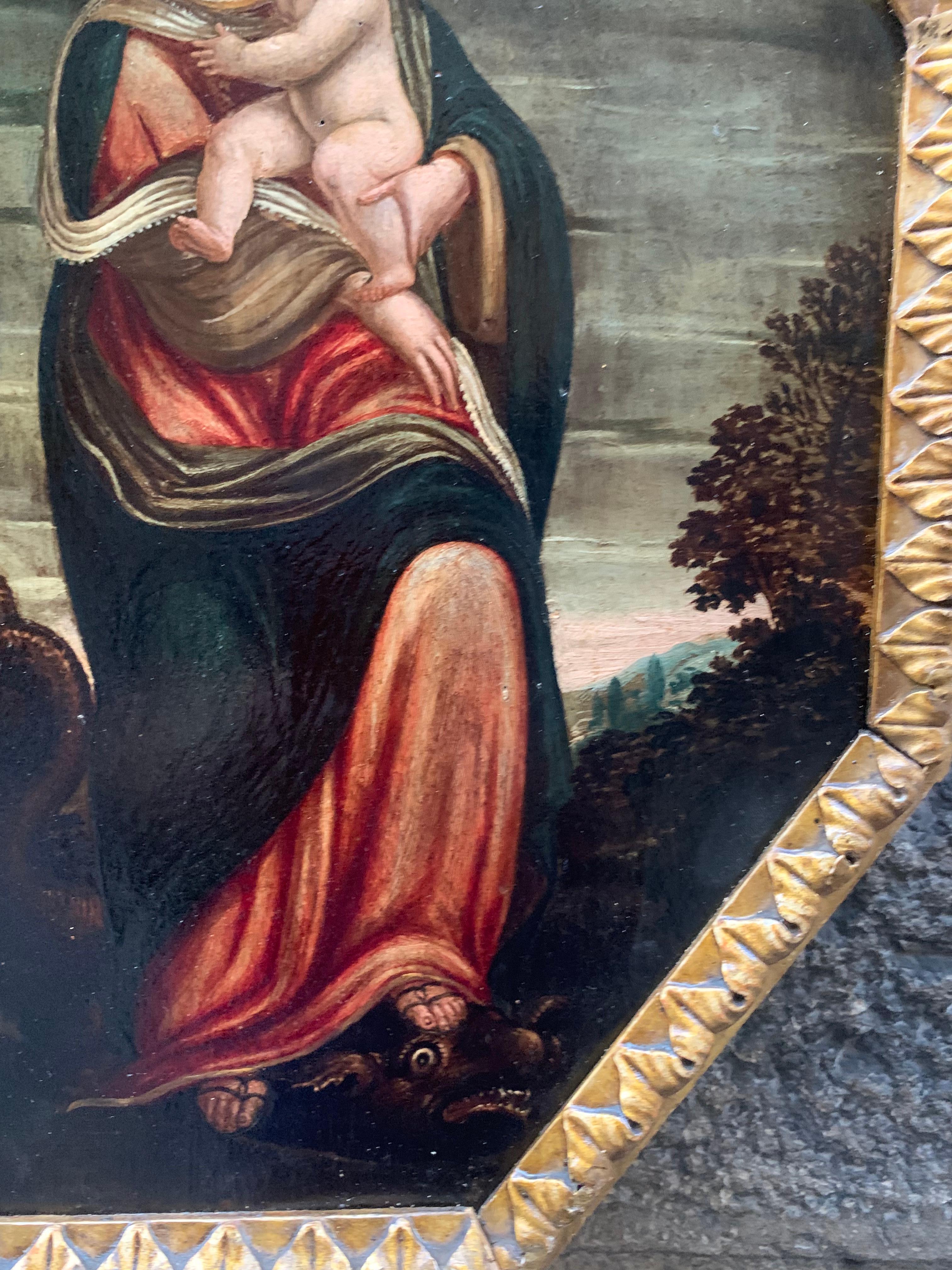 Early 17th century. 
Immaculate conception. 
Virgin with child and dragon.
Technique: oil on wooden tablet.
Painting from the school of central Italy : Tuscany or Umbria or Marche.

The monumental figure of Madonna is depicted against the background