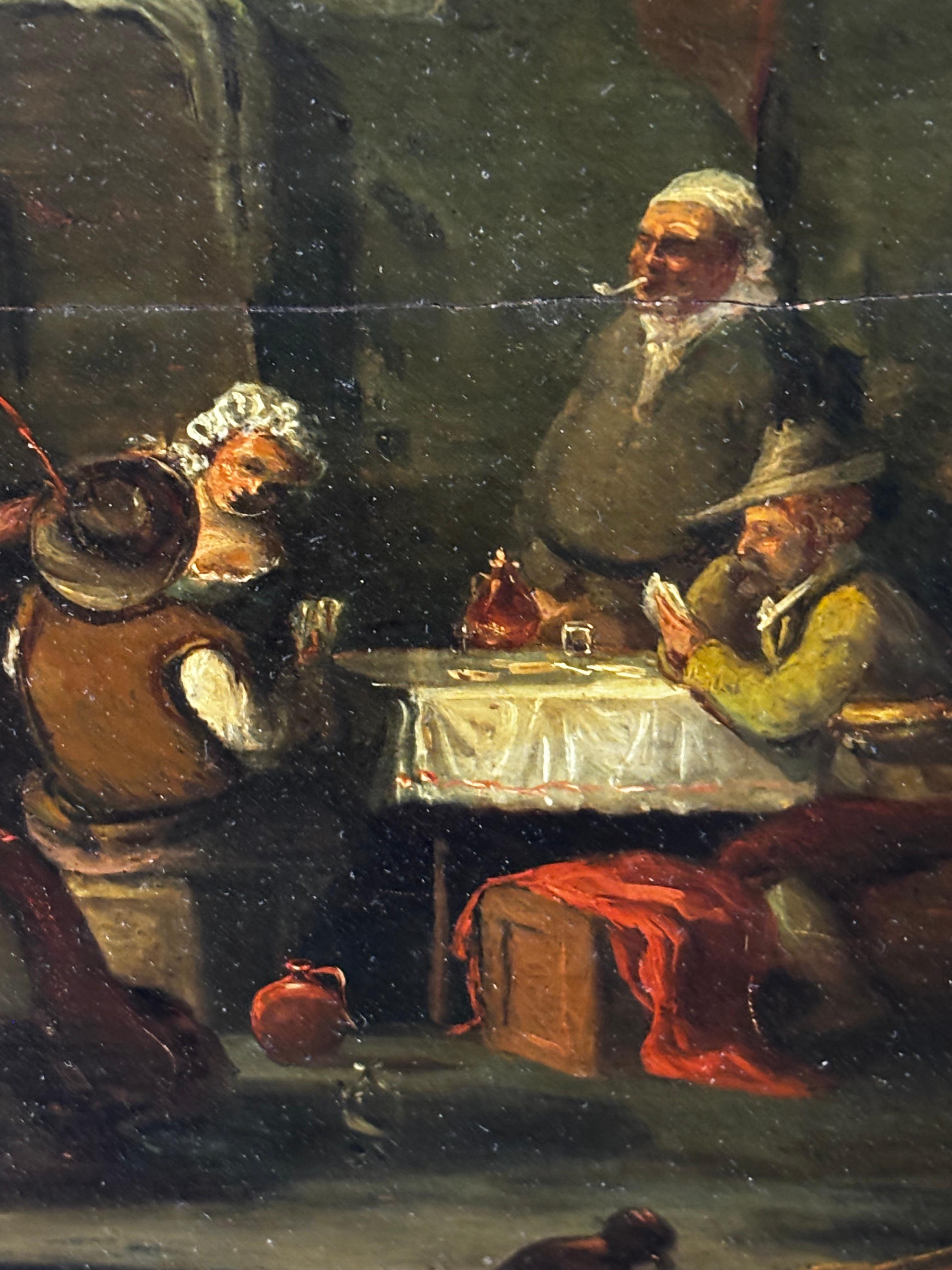 Charming 19th-century oil on panel attributed to the Flemish School, anonymous artist. This work depicts an intimate interior scene with several figures engaged in daily life, characterized by a refined use of chiaroscuro and attention to detail in