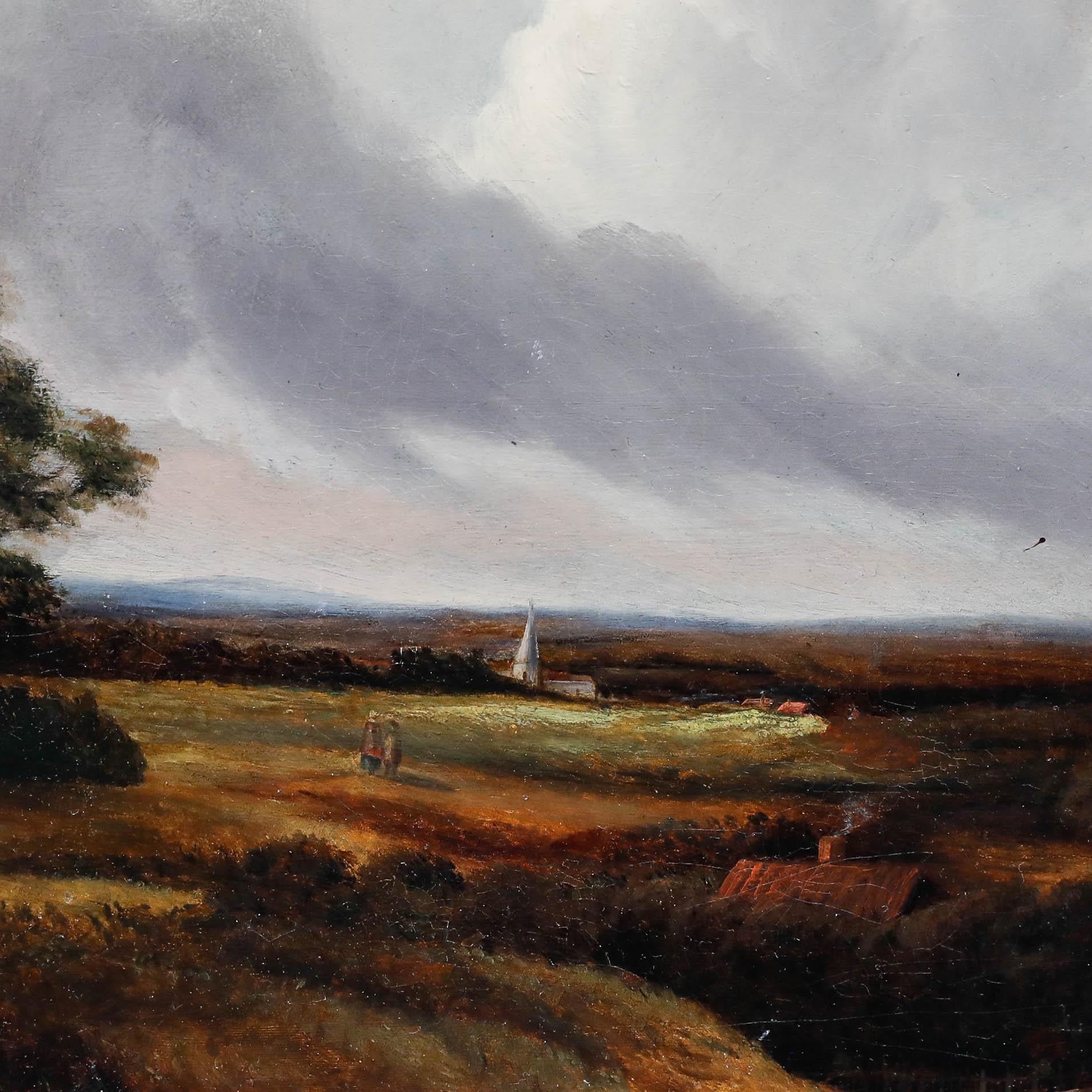 Un atmosférico óleo del siglo XIX que representa un extenso paisaje pastoral con figuras descansando cerca de un tronco talado en primer plano. Sin firmar. Bien presentado en un marco dorado del siglo XX. En lienzo sobre bastidores.