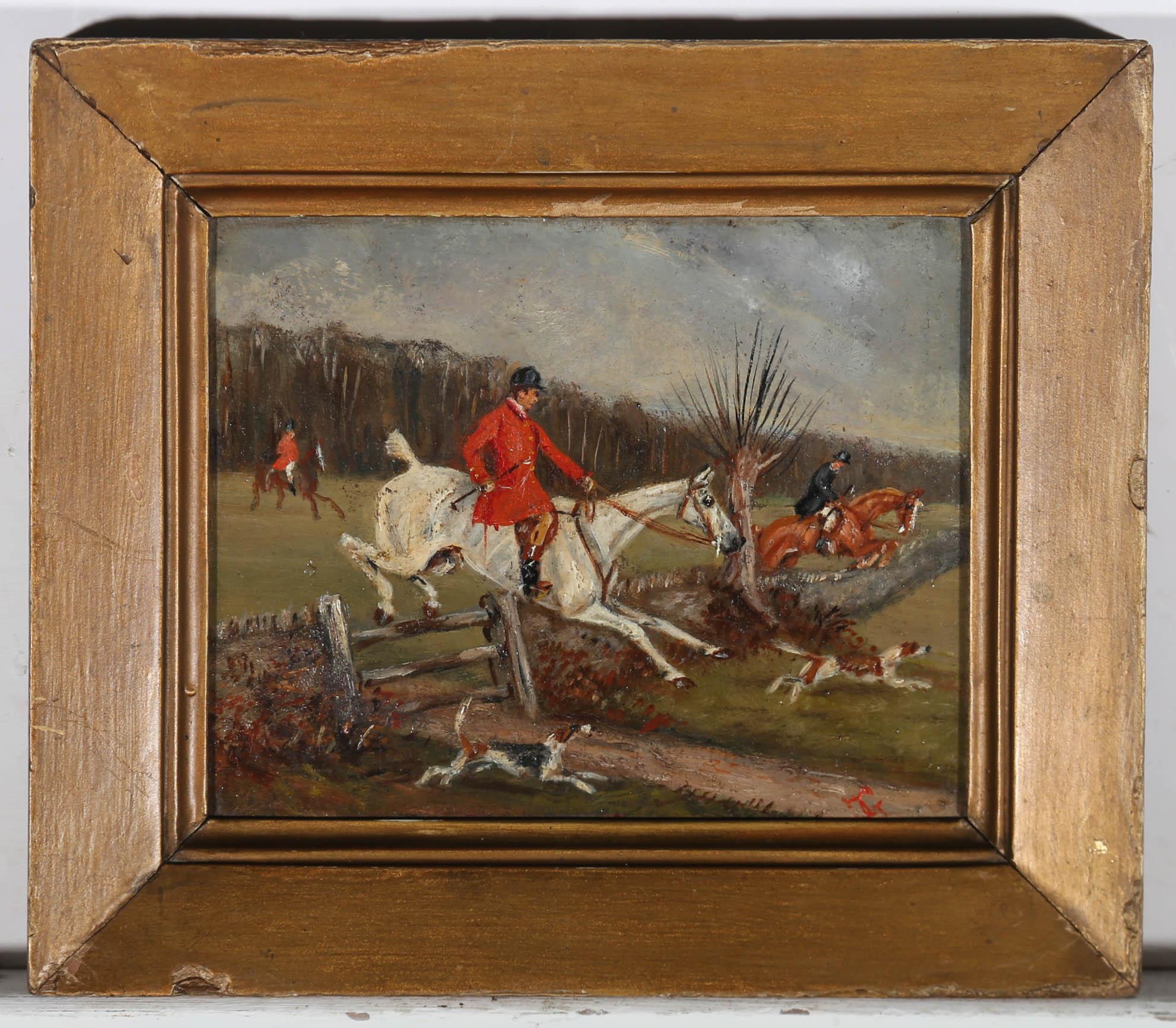 This charming oil depicts a red coated huntsman caught in action, clearing field and fence behind two English Foxhounds. The painting is signed with the artist's monogram to the lower right. Well presented in a rustic gilt-effect frame. On panel. 
