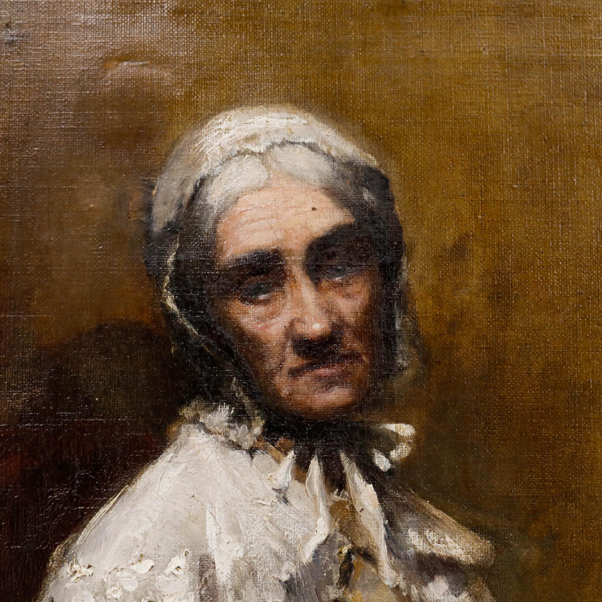 Ce portrait intime représente une dame âgée assise dans un fauteuil. Elle renvoie le regard du spectateur avec une expression solennelle. Bien présenté dans un cadre sculpté à effet doré. Non signée. Sur toile sur châssis. Taille de l'image : 39 x