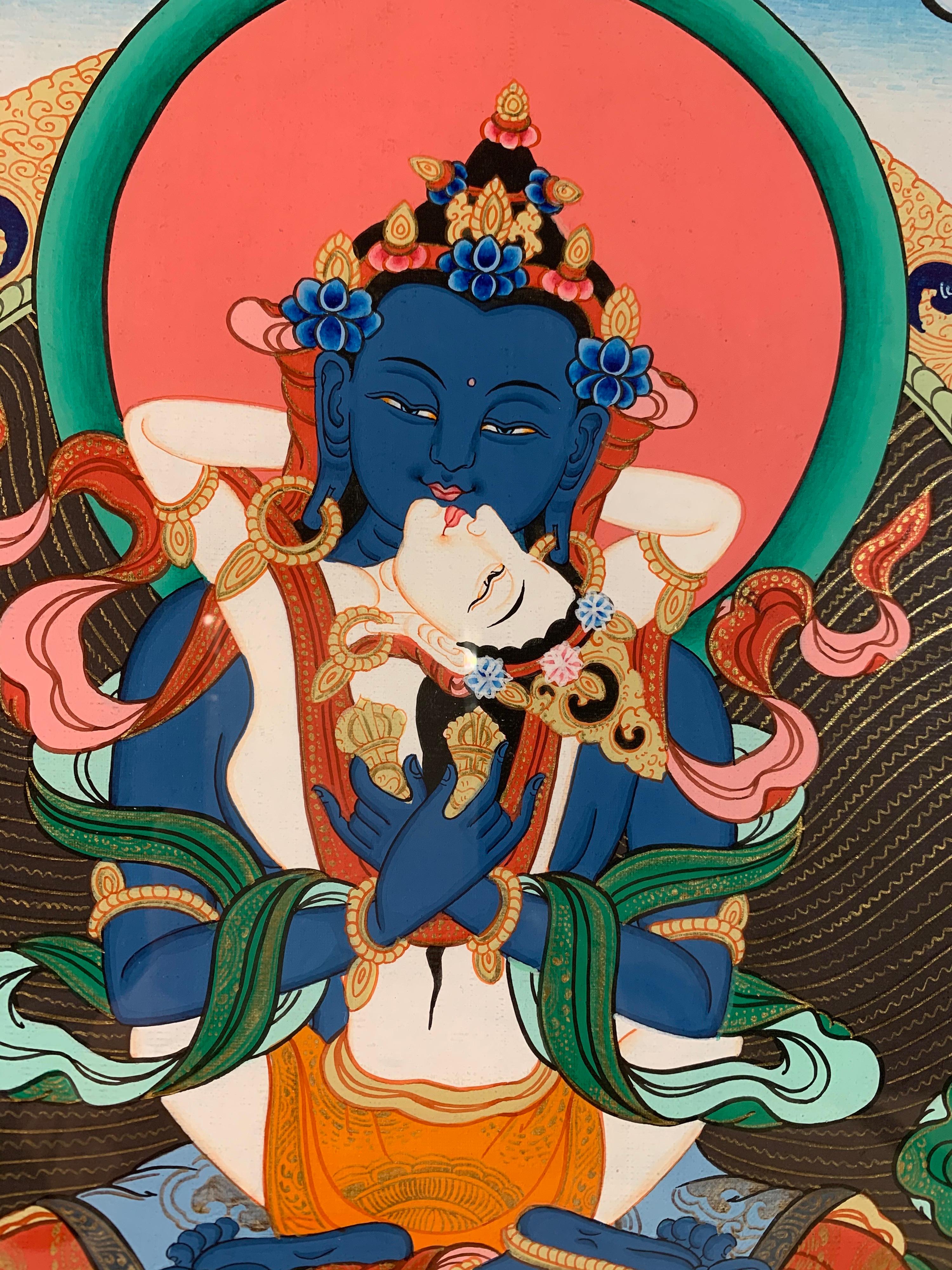 This framed figurative thangka of Buddha-Shakti is hand painted on canvas with 24k real gold.
This thangka depicts Buddha and Shakti in intimate embrace or 