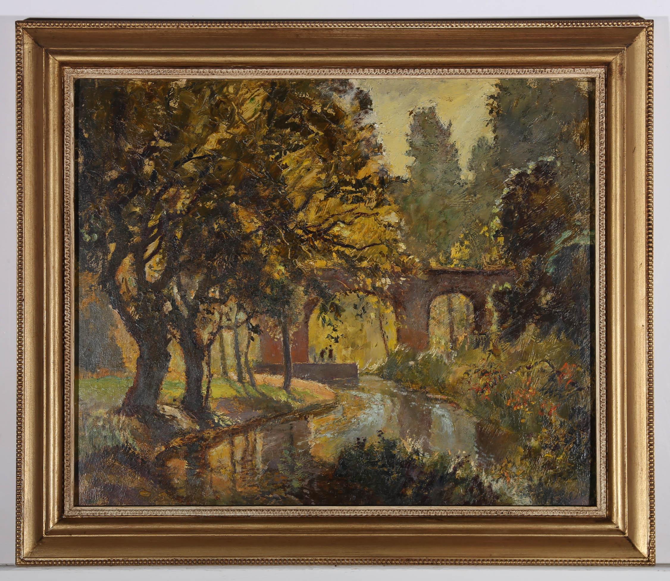 This vibrant impasto scene depicts the end of summer along the canal, with golden trees glowing in the warm sunlight before a railway bridge. Two silhouettes can be seen pictured beneath one of the stone arches, close to the water's edge. Unsigned.