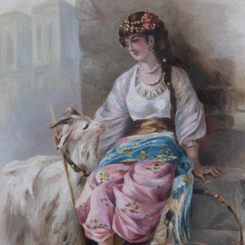 A beautiful oil study of a Gypsy performer in the streets of Paris, captured alongside her pet goat. The lady wears a gold coin headpiece and pearl necklace with a colourful wrap skirt and white blouse. The painting has been well-presented in a