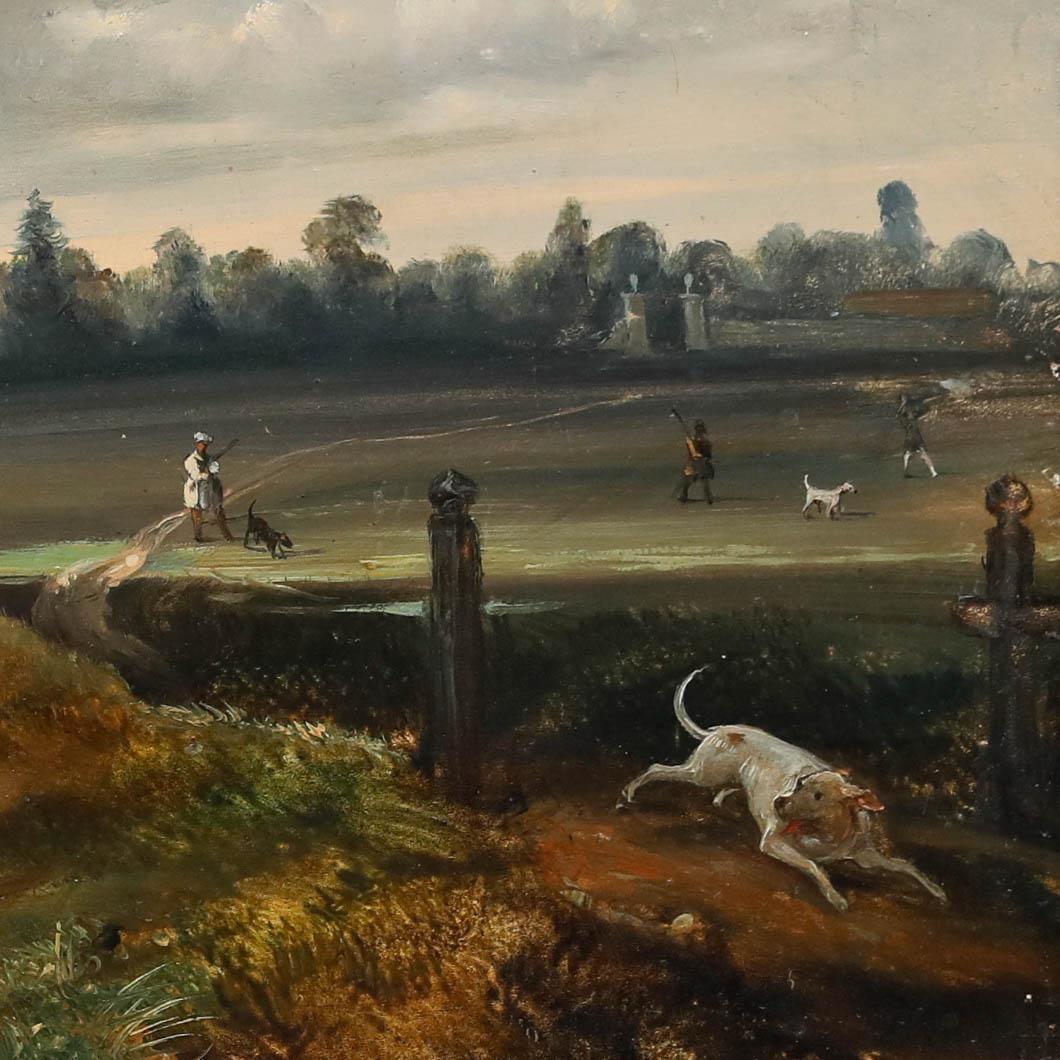 A charming mid-19th century hunting scene depicting guns and their dogs lined out across a landscape, ready for any oncoming game. Well presented in a distressed gilt effect frame with a delicate running pattern to the inner window. Fixed with a C.