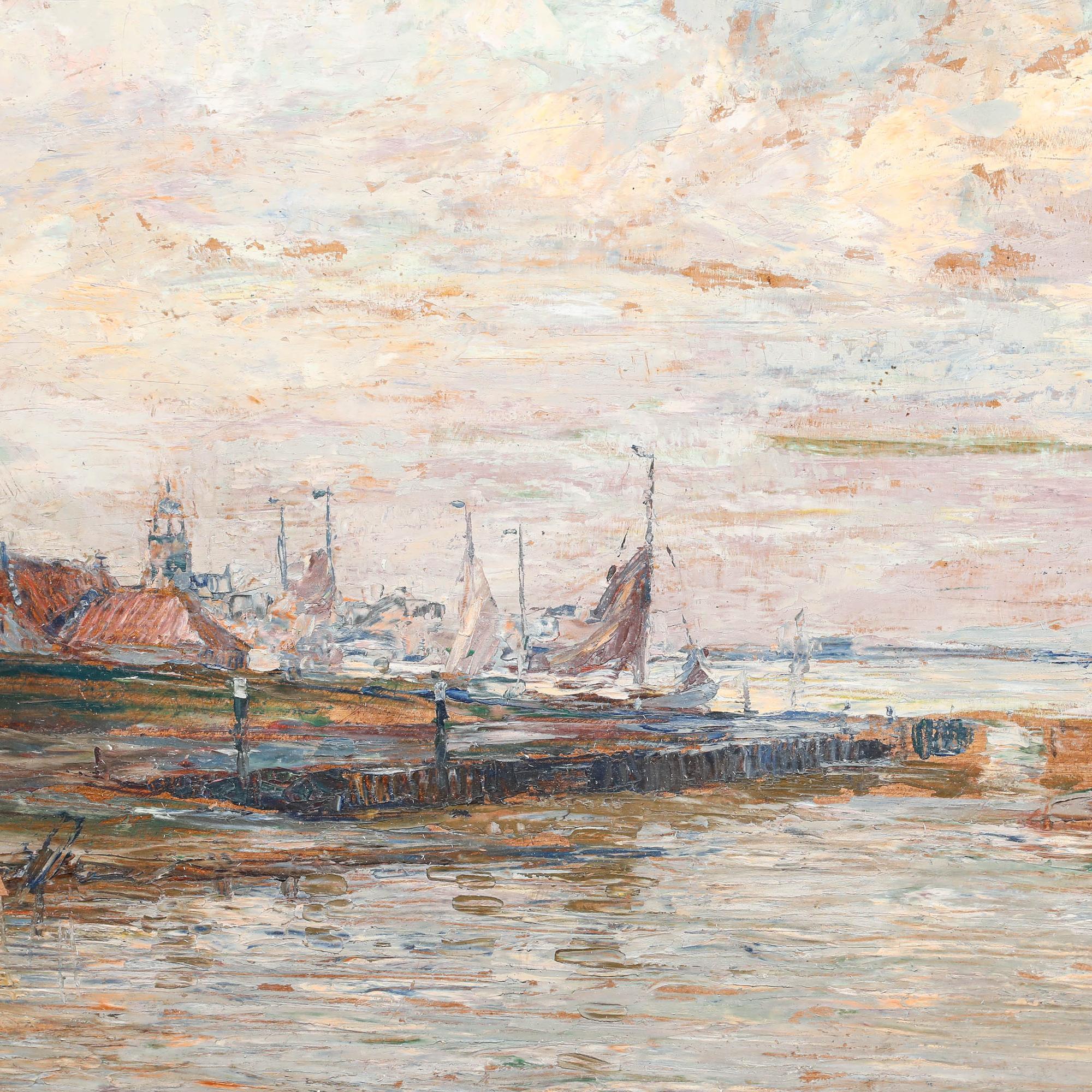 This atmospheric oil painting depicts a Dutch coastal scene at sunset, with a traditional windmill positioned along a quiet waterway with sailing vessels in the distance. Well presented in an elaborate gilt effect frame with shell and acanthus