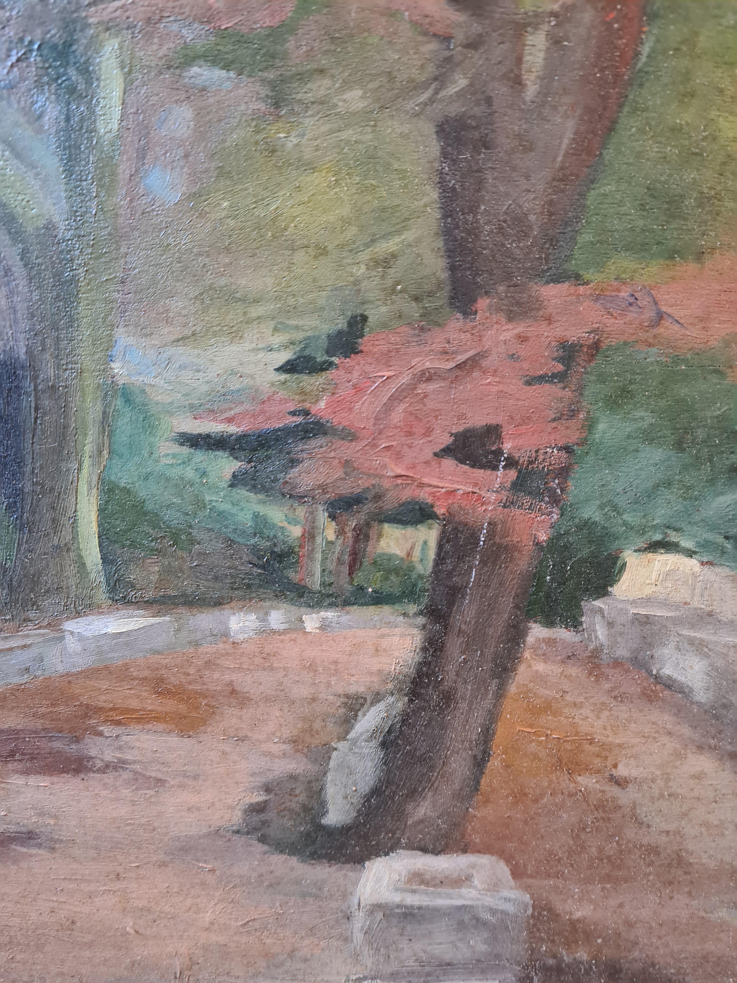 French Impressionist oil on board of a wooded landscape presented in a period carved wood gilt and patinated frame with trade label to the reverse for a gallery in Grenoble.

A charming view of a pathway into a wood or park, the trees in full