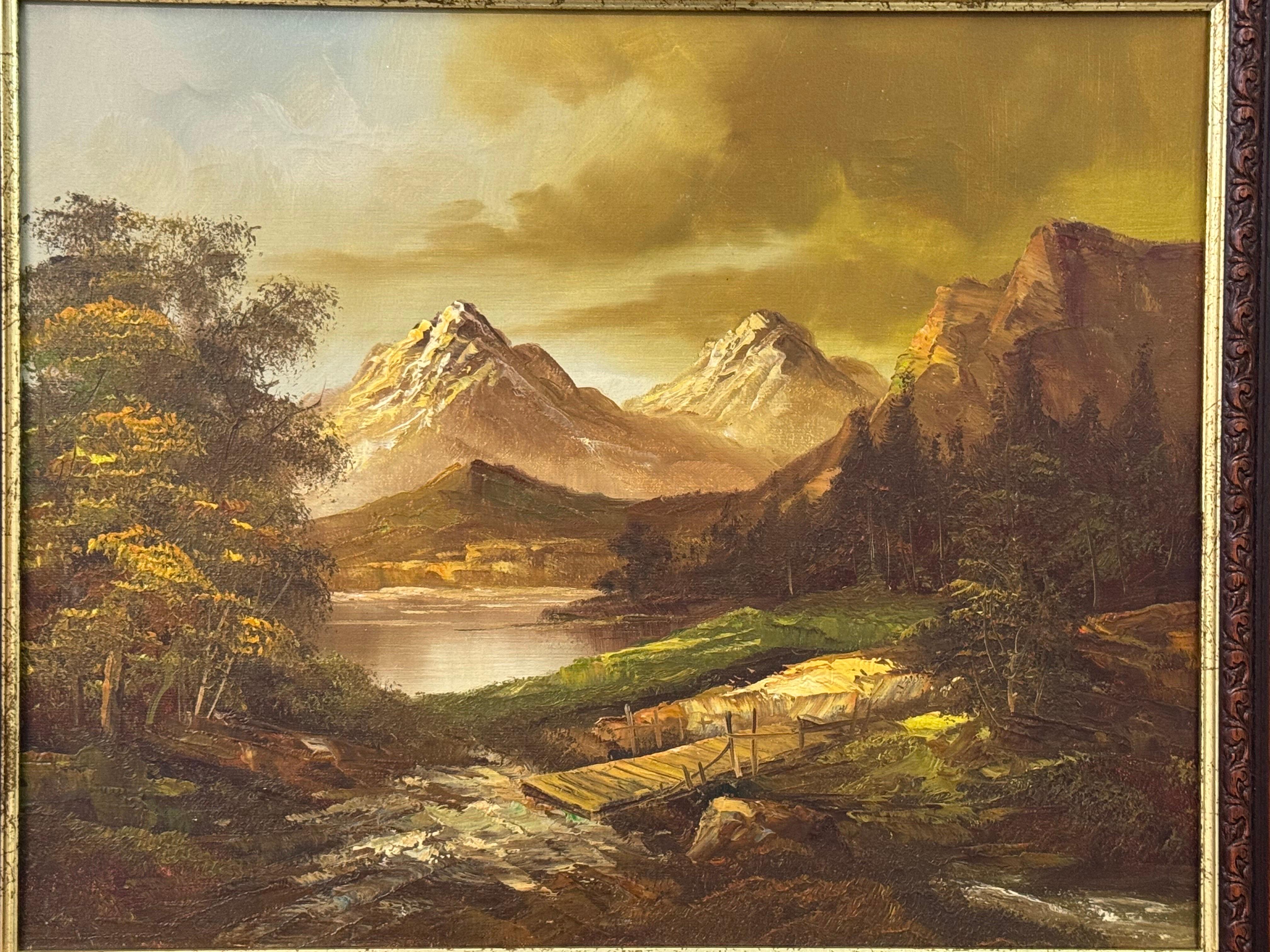 Goldene Berggipfel erheben sich über einem ruhigen Fluss, wo sich Licht und Einsamkeit treffen im Angebot 10