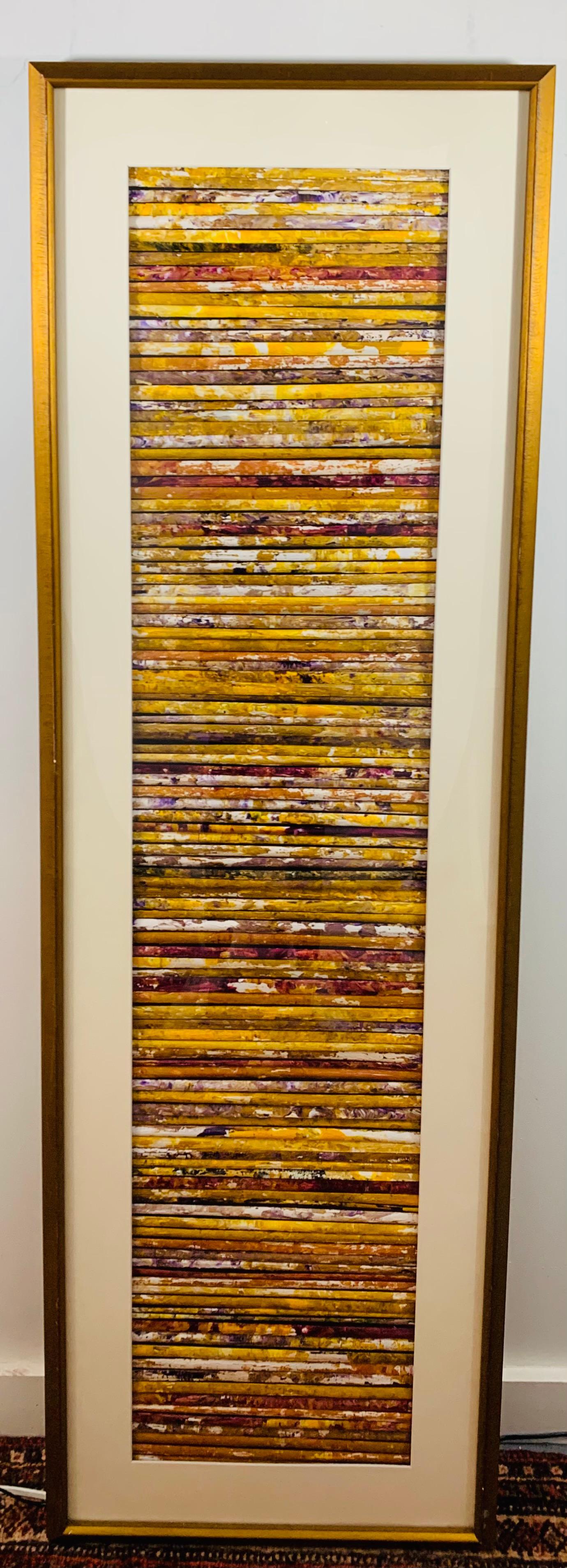 This nature inspired modern horizontal wall art piece is made of reeds that are glued into a wood frame that is hidden by the mat in the final framing. Created by Cheryl & Steven Ward, this modern piece will add color and a nature touch to any wall